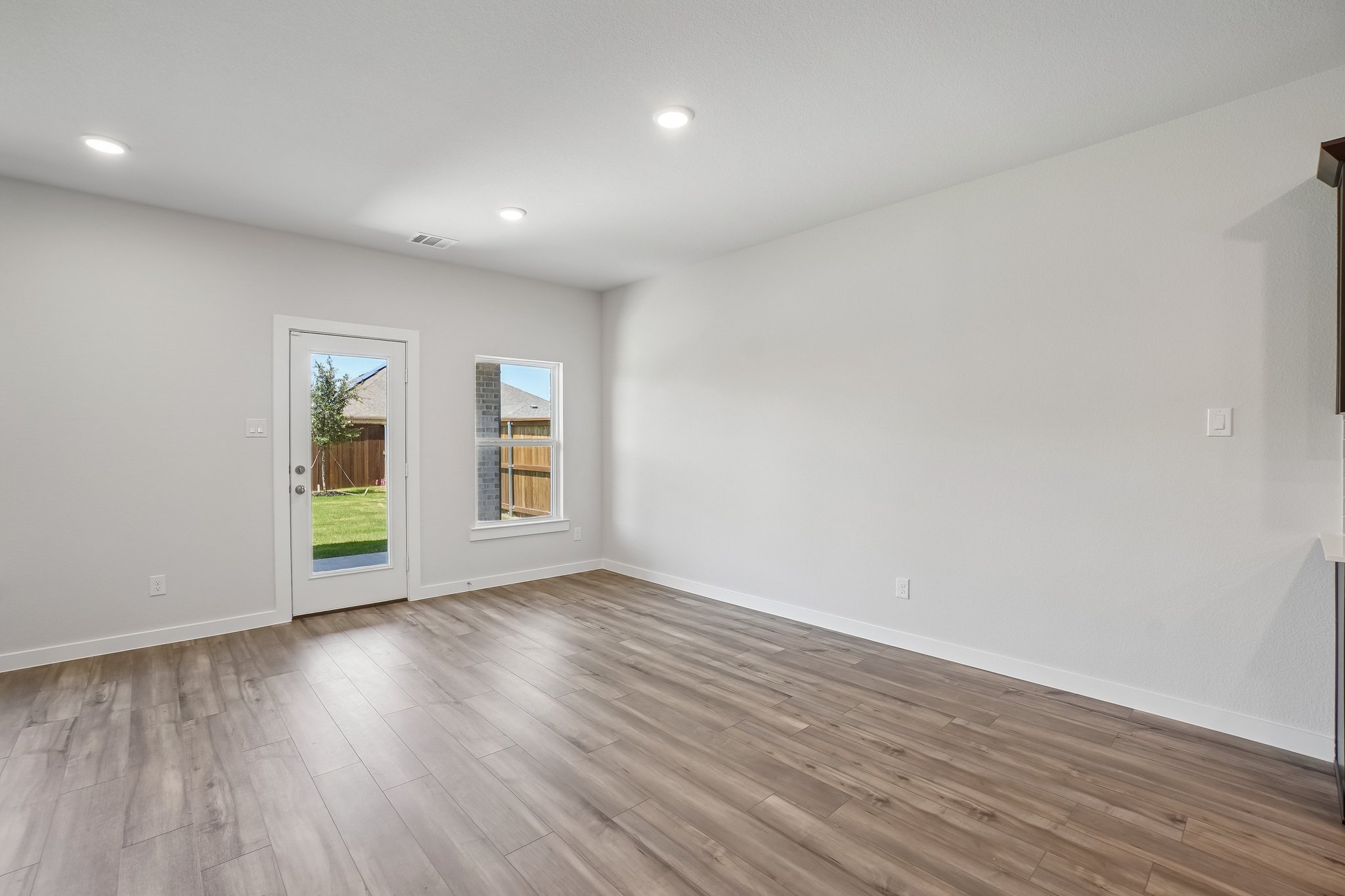 A room with a wood floor and a wood floor.