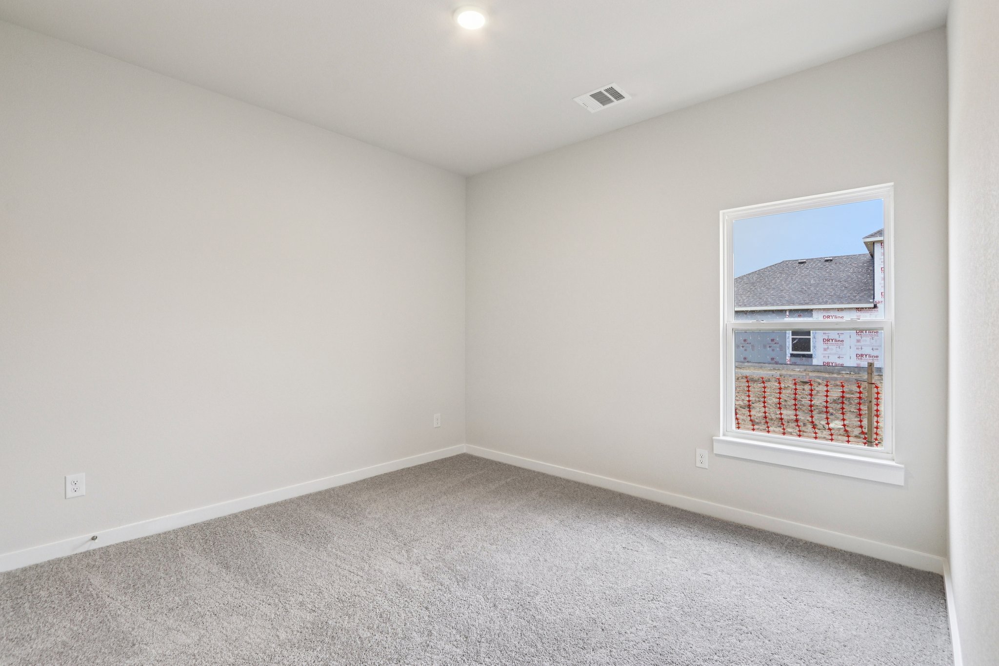 A room with a window and a door.