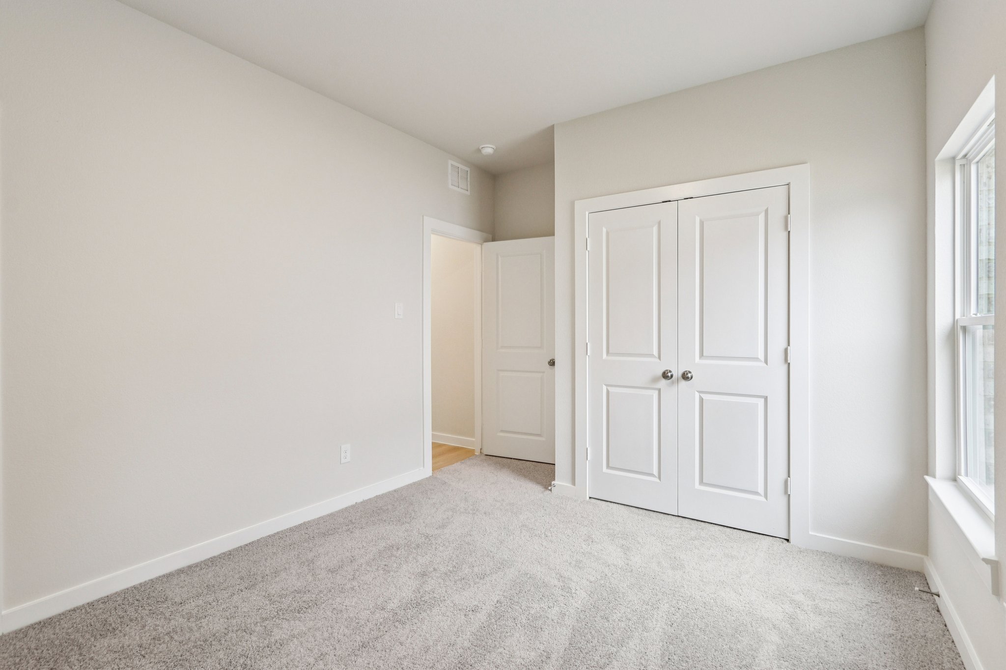A room with white doors.