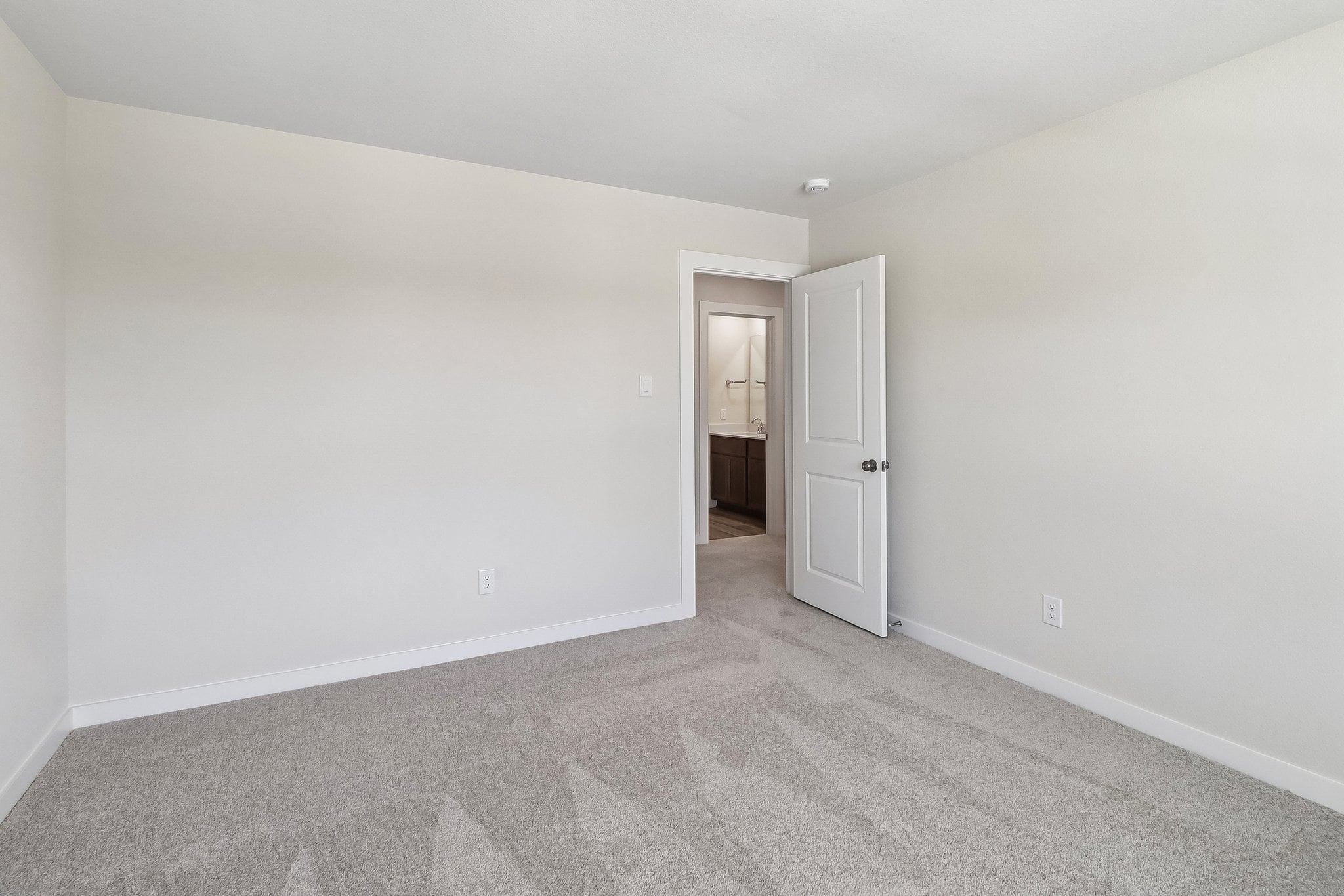 A hallway with white walls.