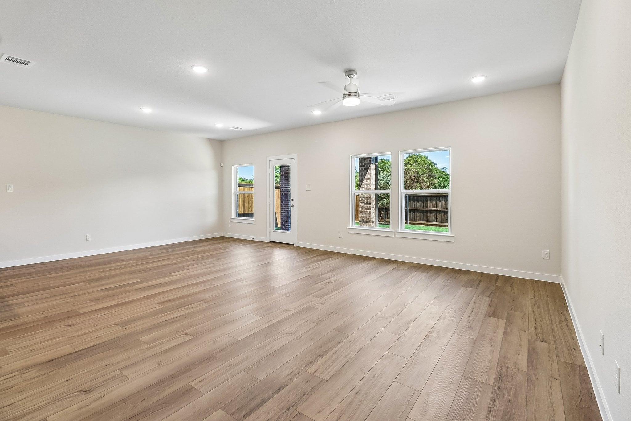 A room with a wood floor and a wood floor.