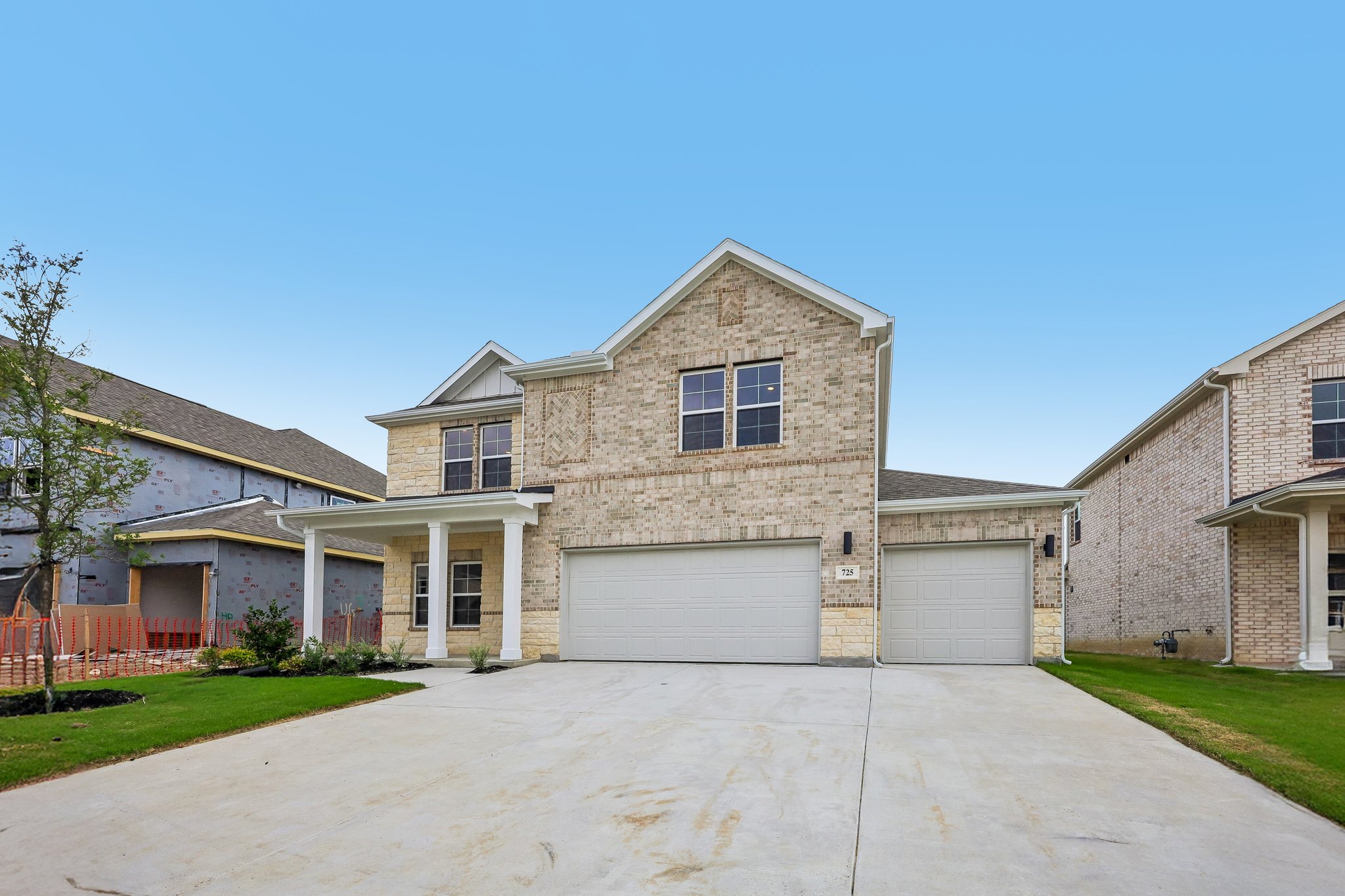 A building with garages and a driveway.