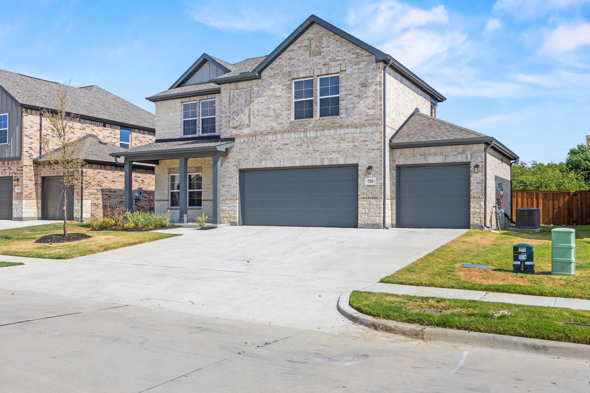A house with garages and a driveway.