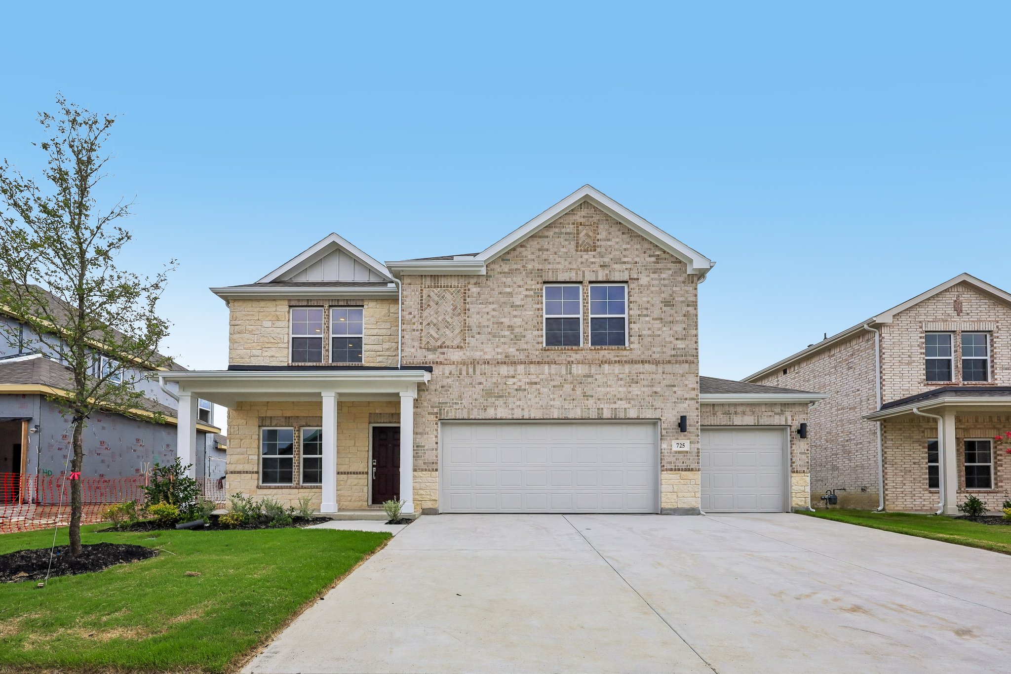 A large house with a driveway.