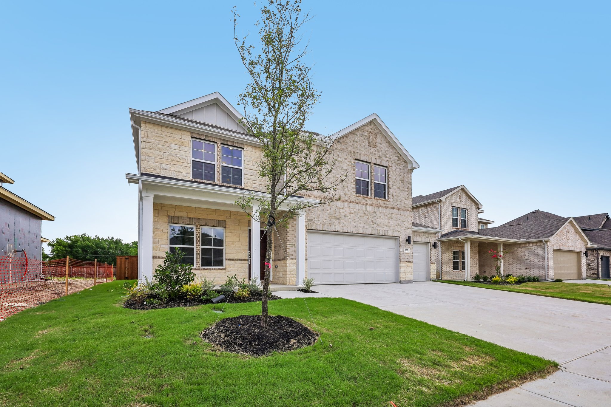 A large house with a driveway.