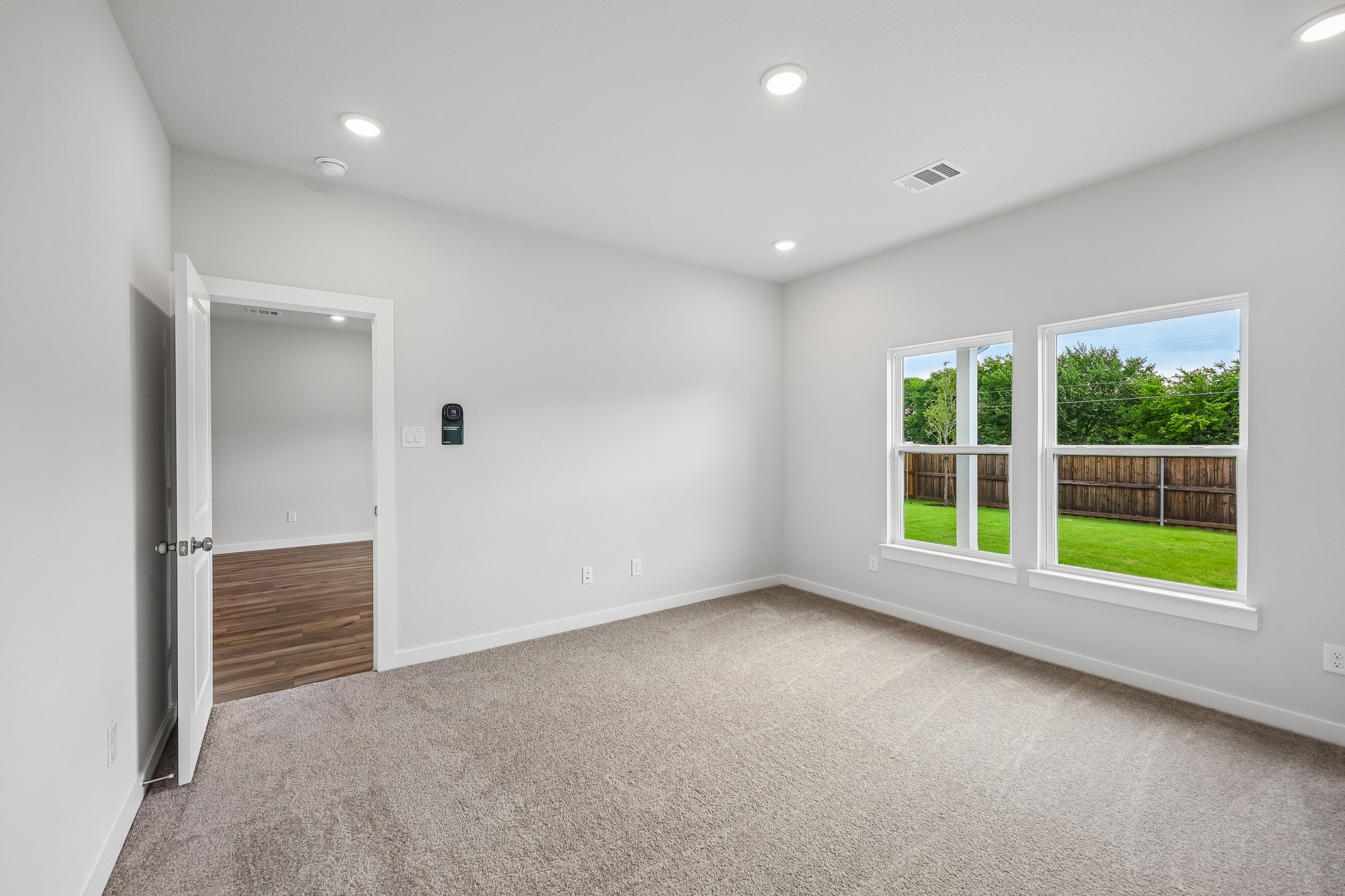 A room with a door and windows.