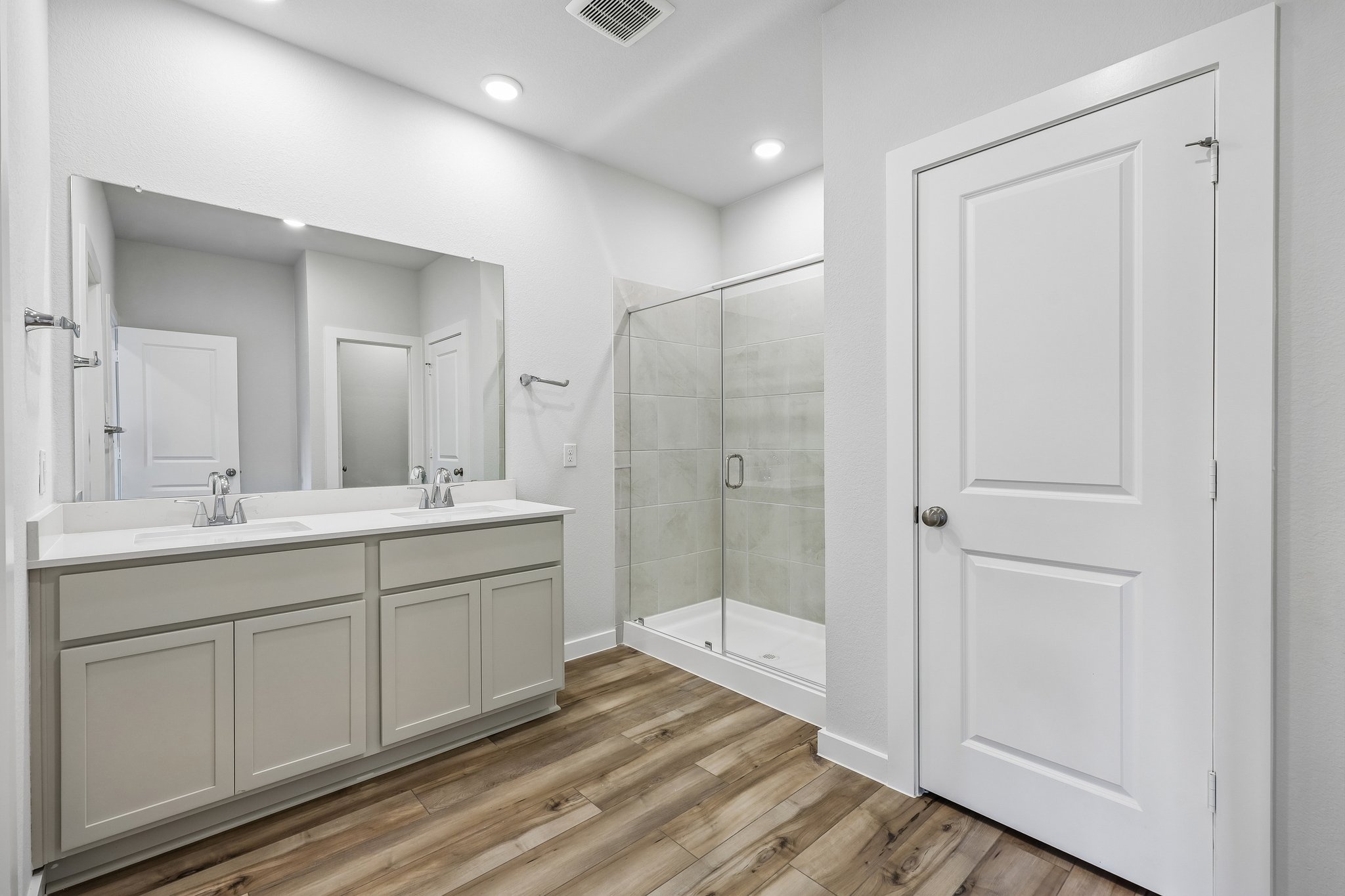 A bathroom with a glass shower.