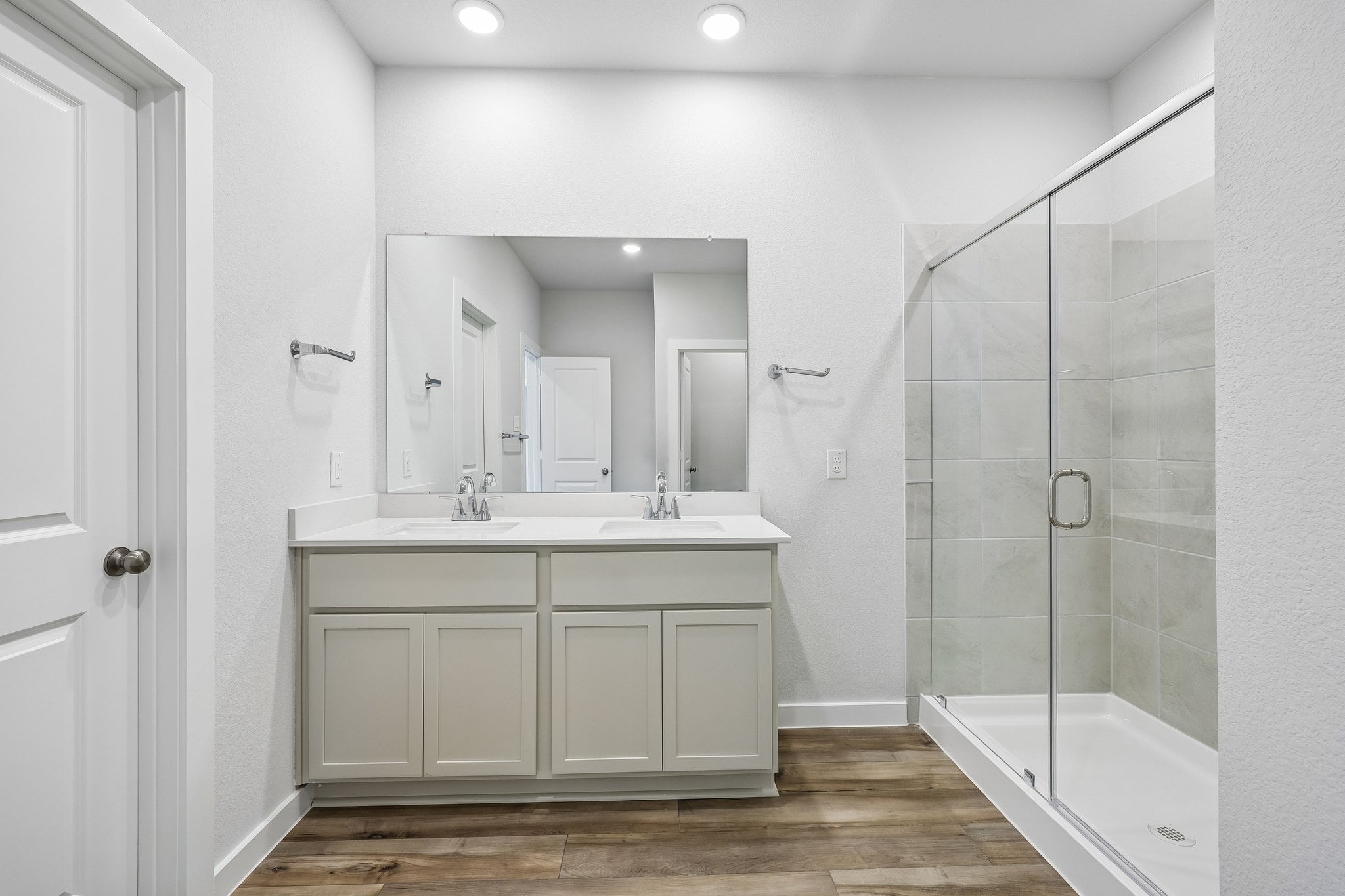 A bathroom with a glass shower.