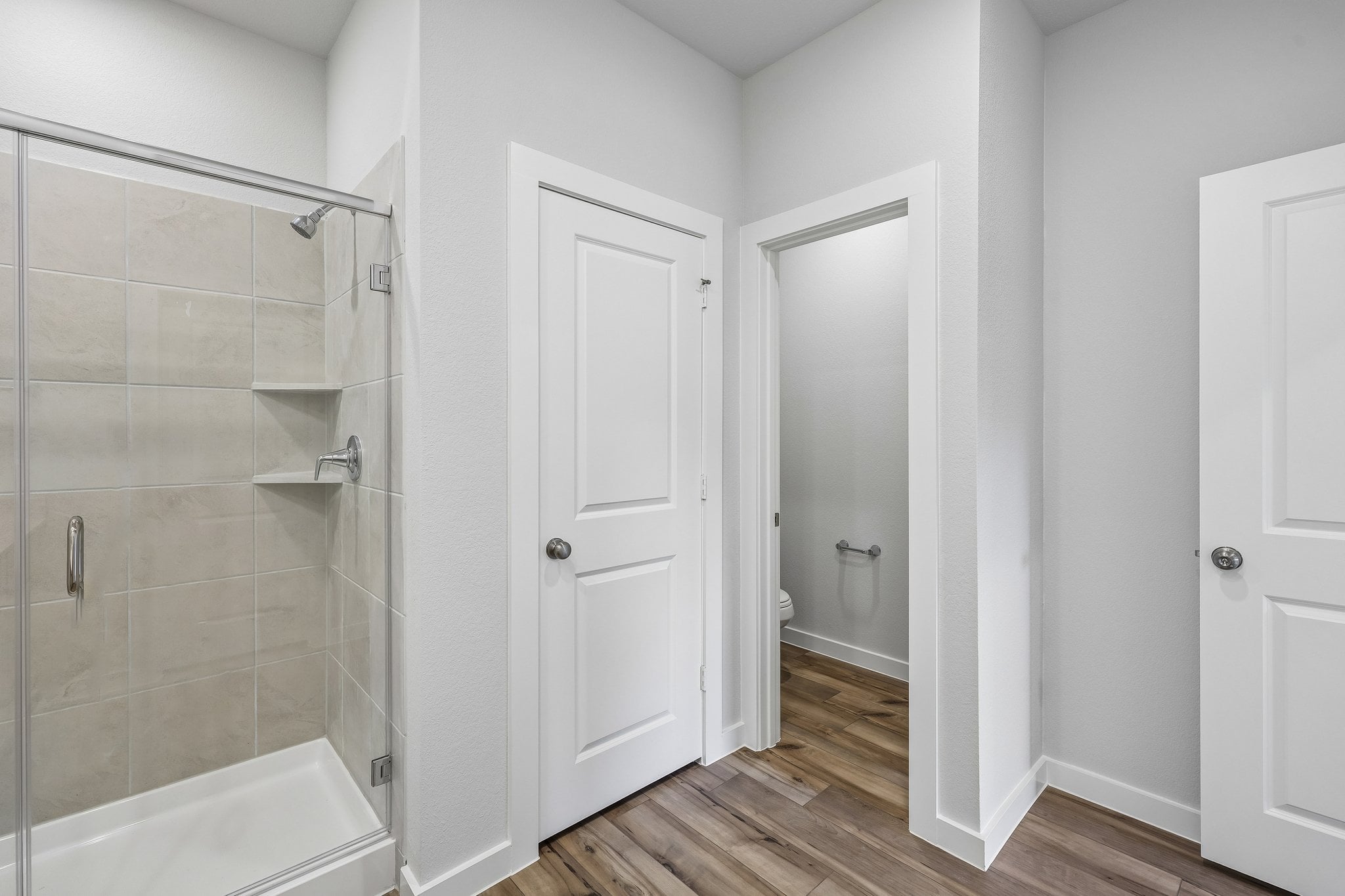 A bathroom with a glass shower.