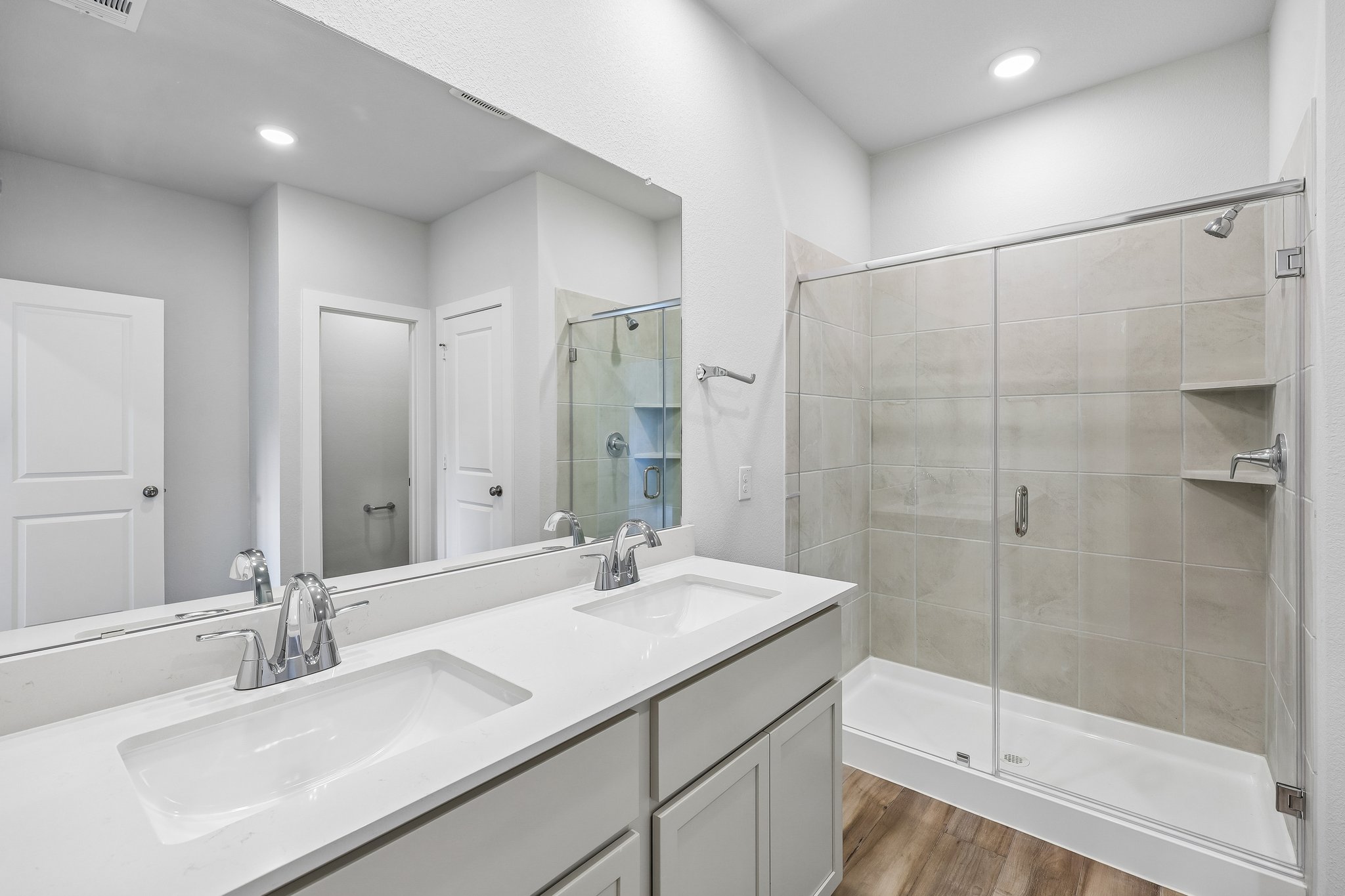 A bathroom with a glass shower.