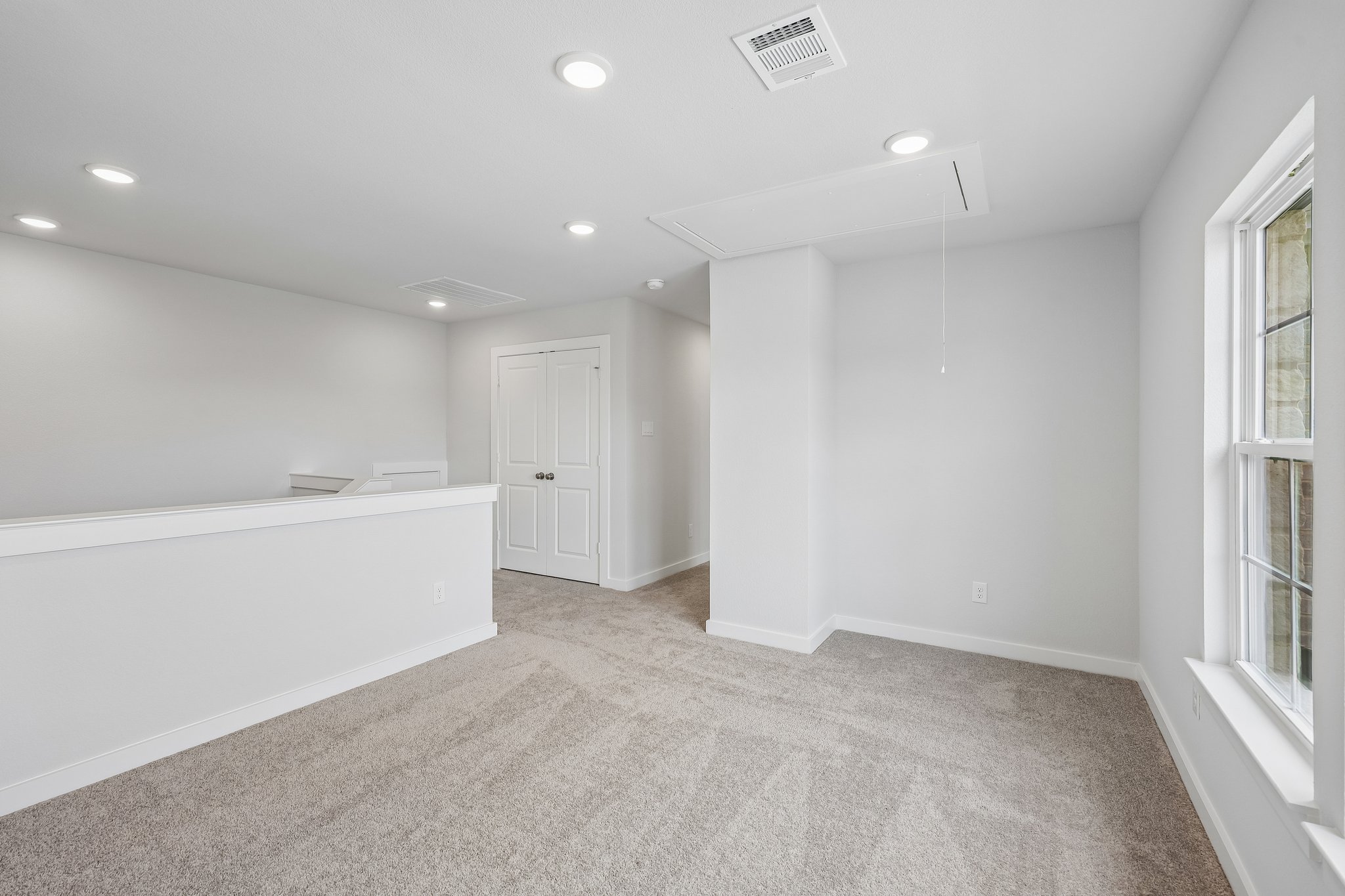 A room with white walls and a white floor.