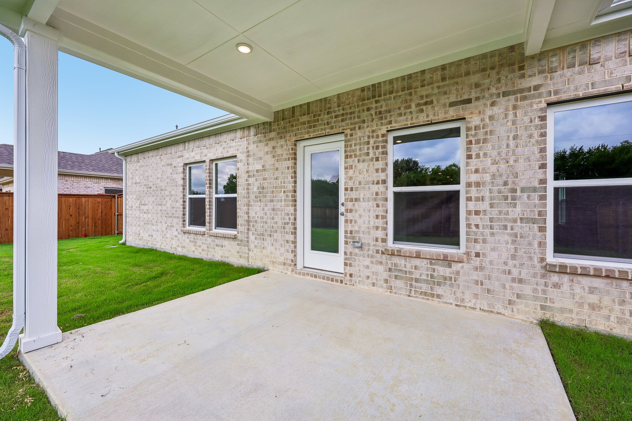 A house with a stone patio.