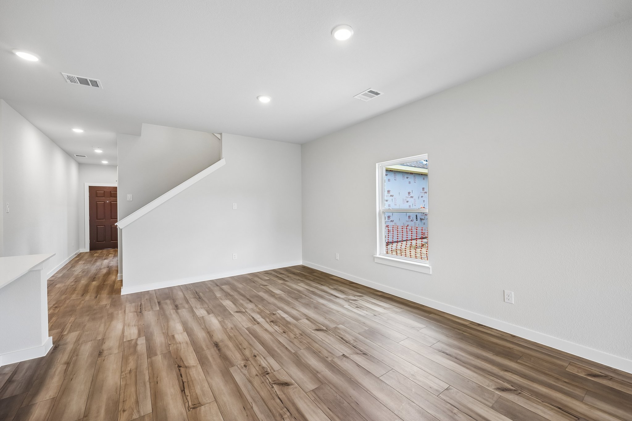 A room with a wood floor and a wood floor.