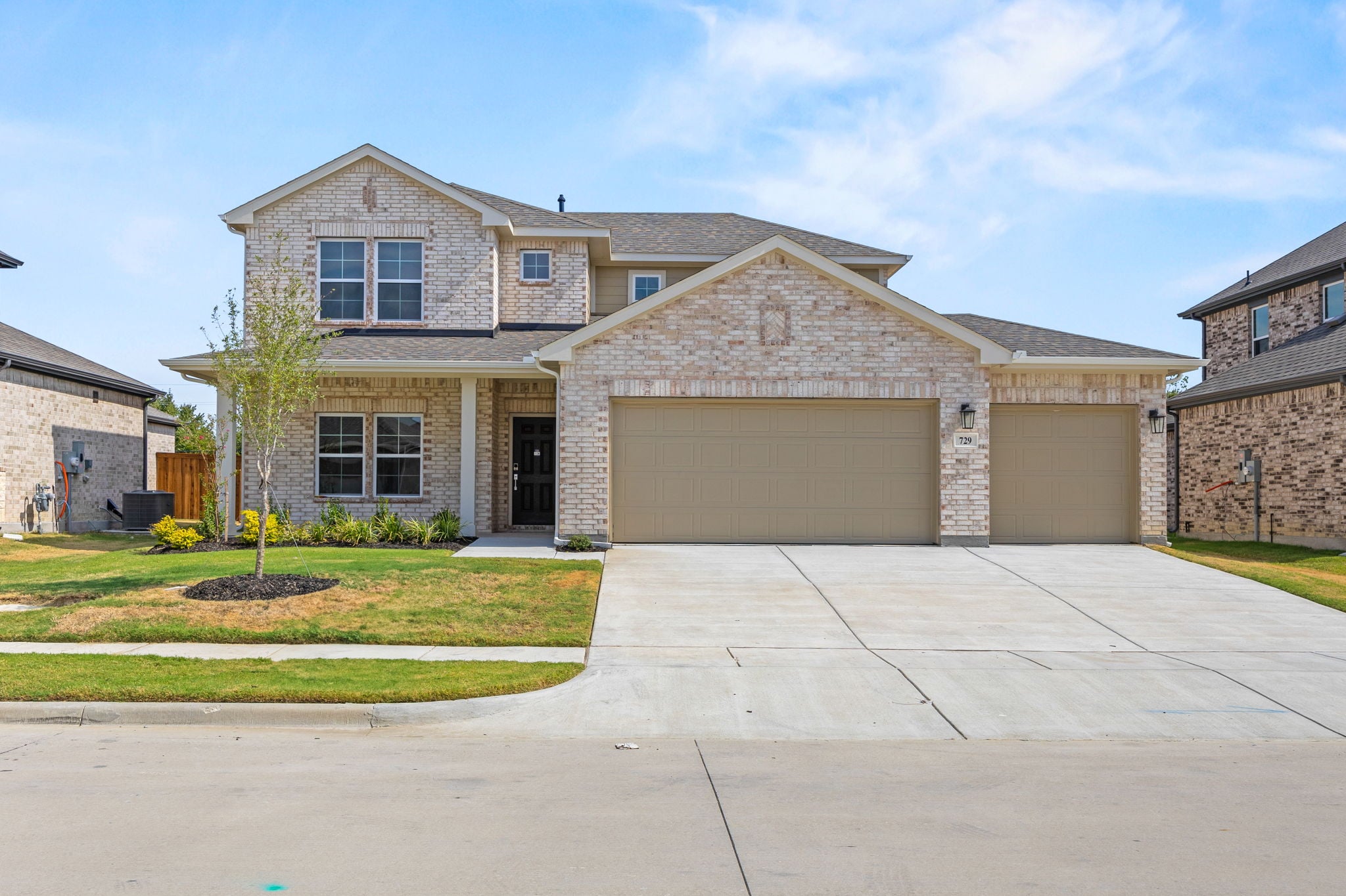 A large house with a driveway.