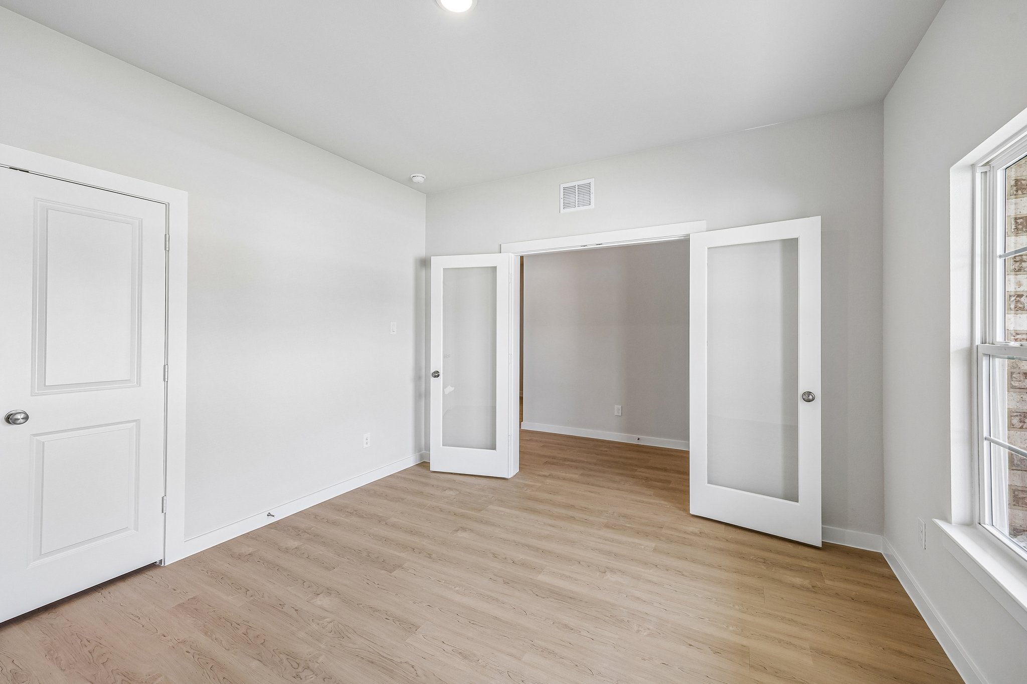 A room with white doors.