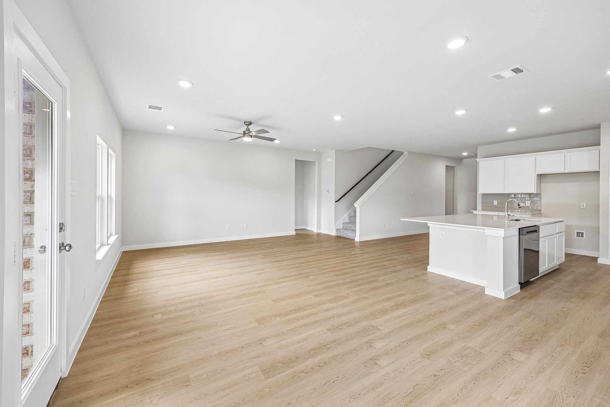 A large kitchen with white cabinets.