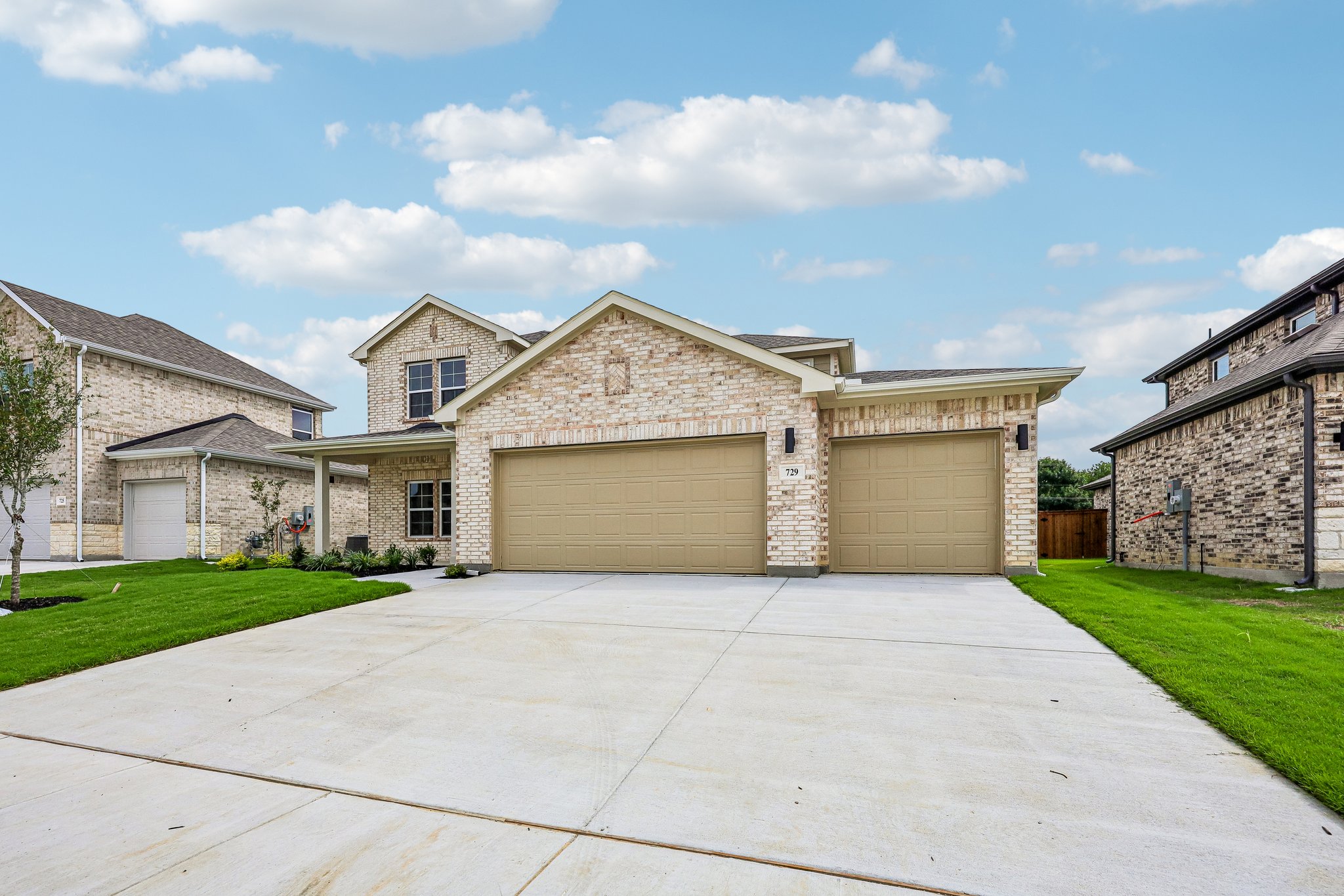 A driveway leading to a house.