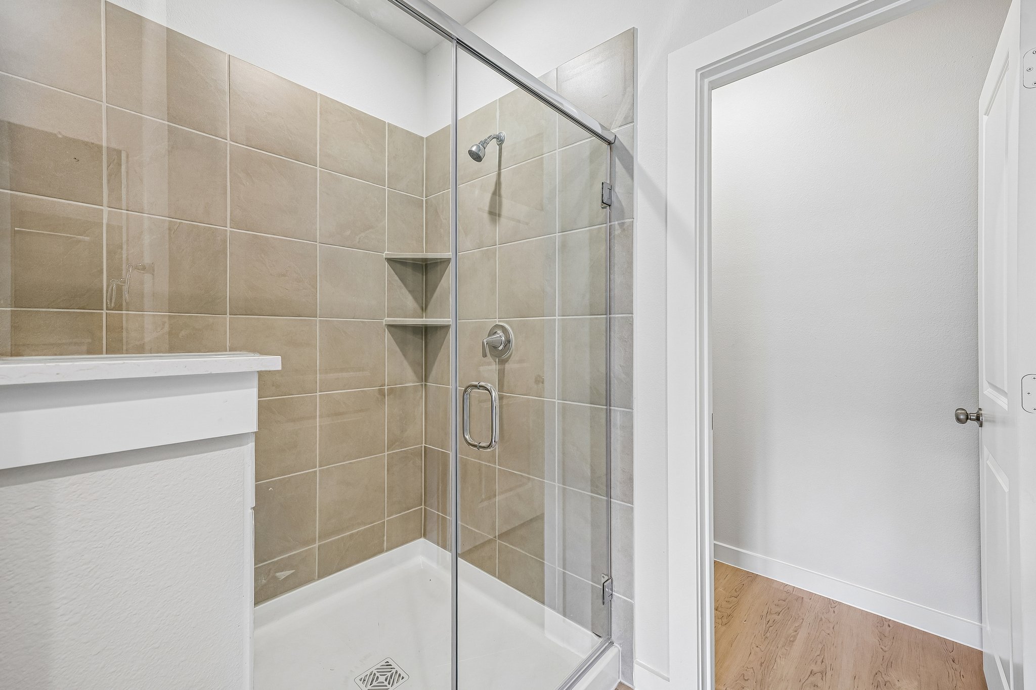 A bathroom with a glass shower.