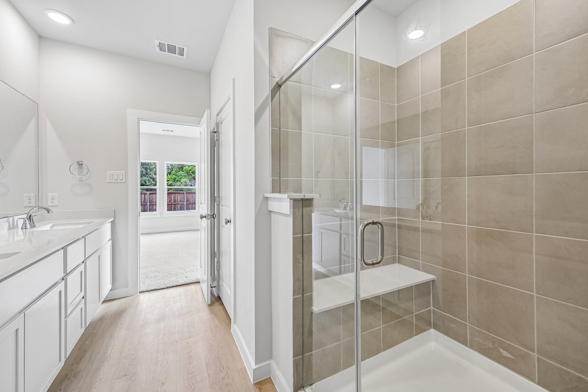 A bathroom with a glass shower.