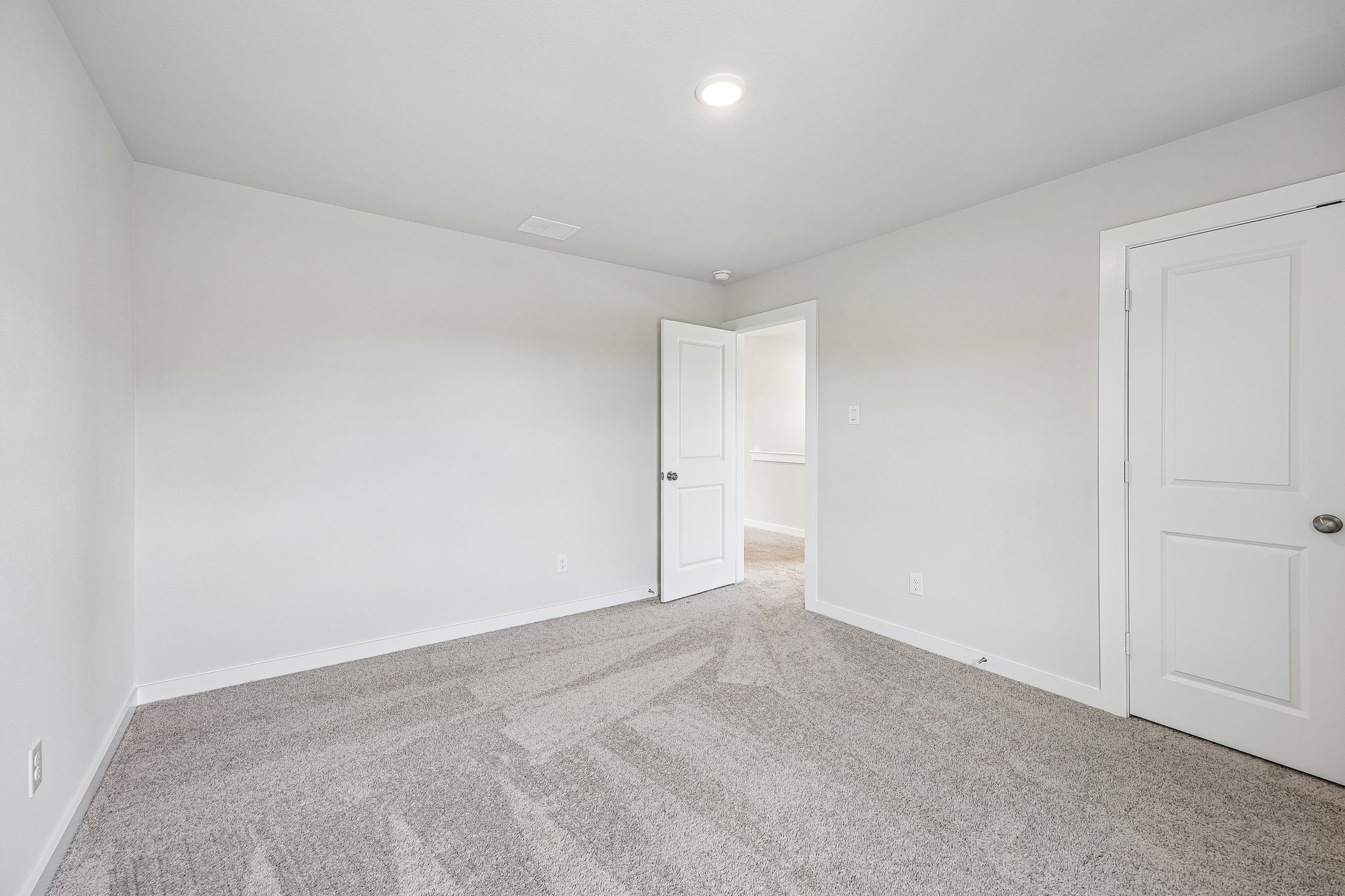A room with white doors.