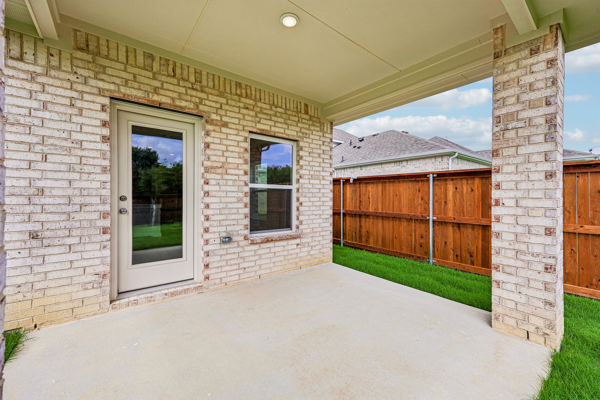 A brick house with a garage.