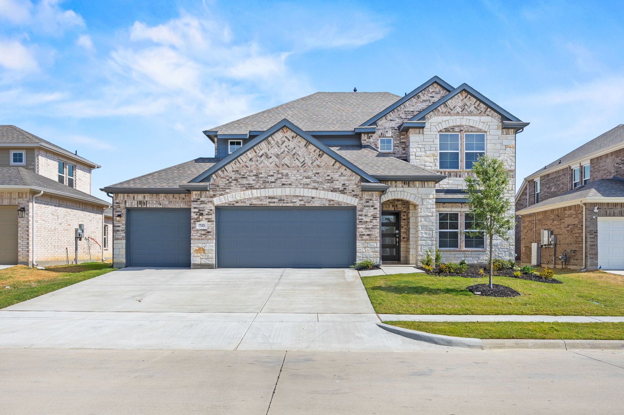 A large house with garages.