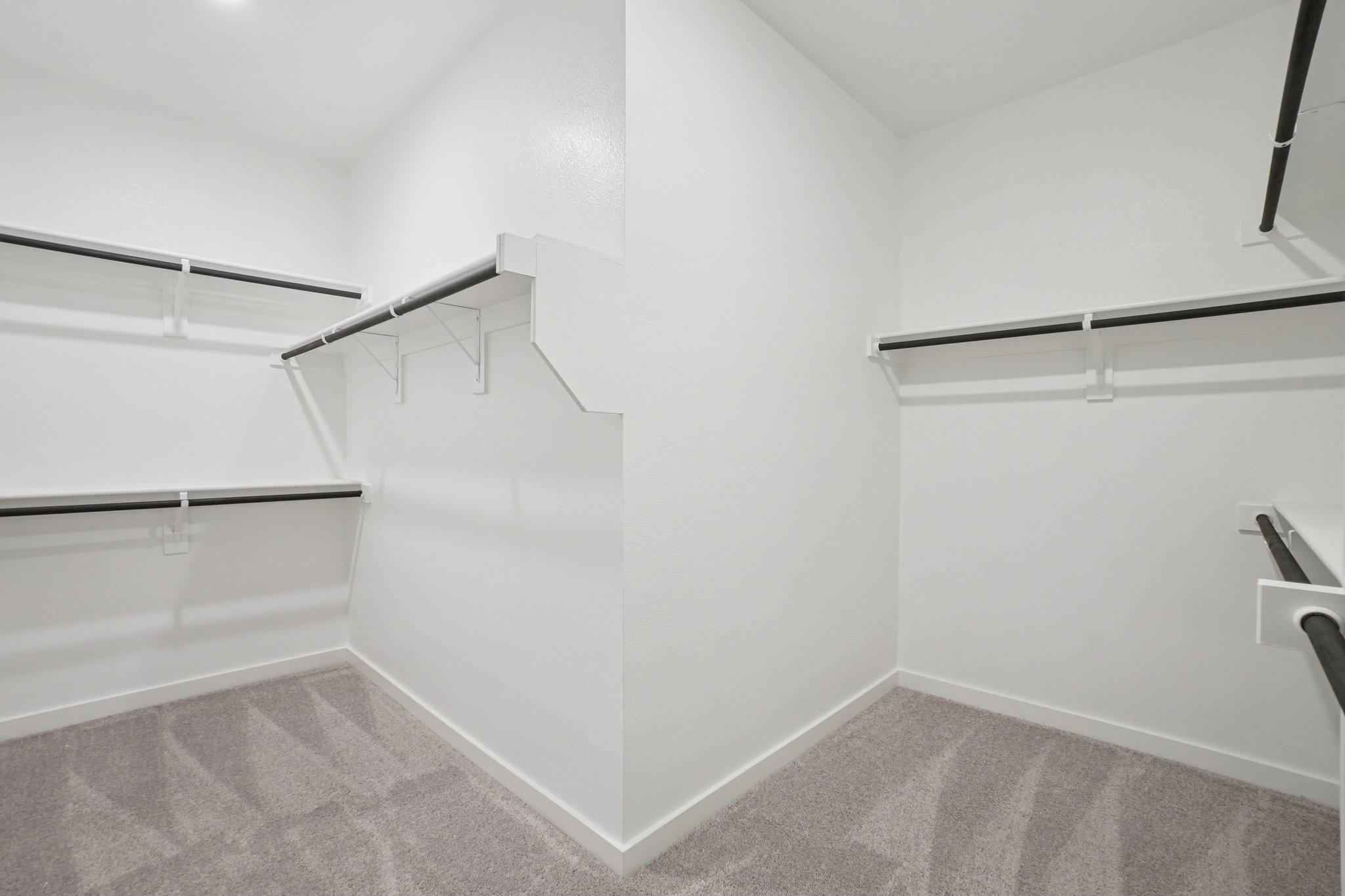 A white room with a staircase.