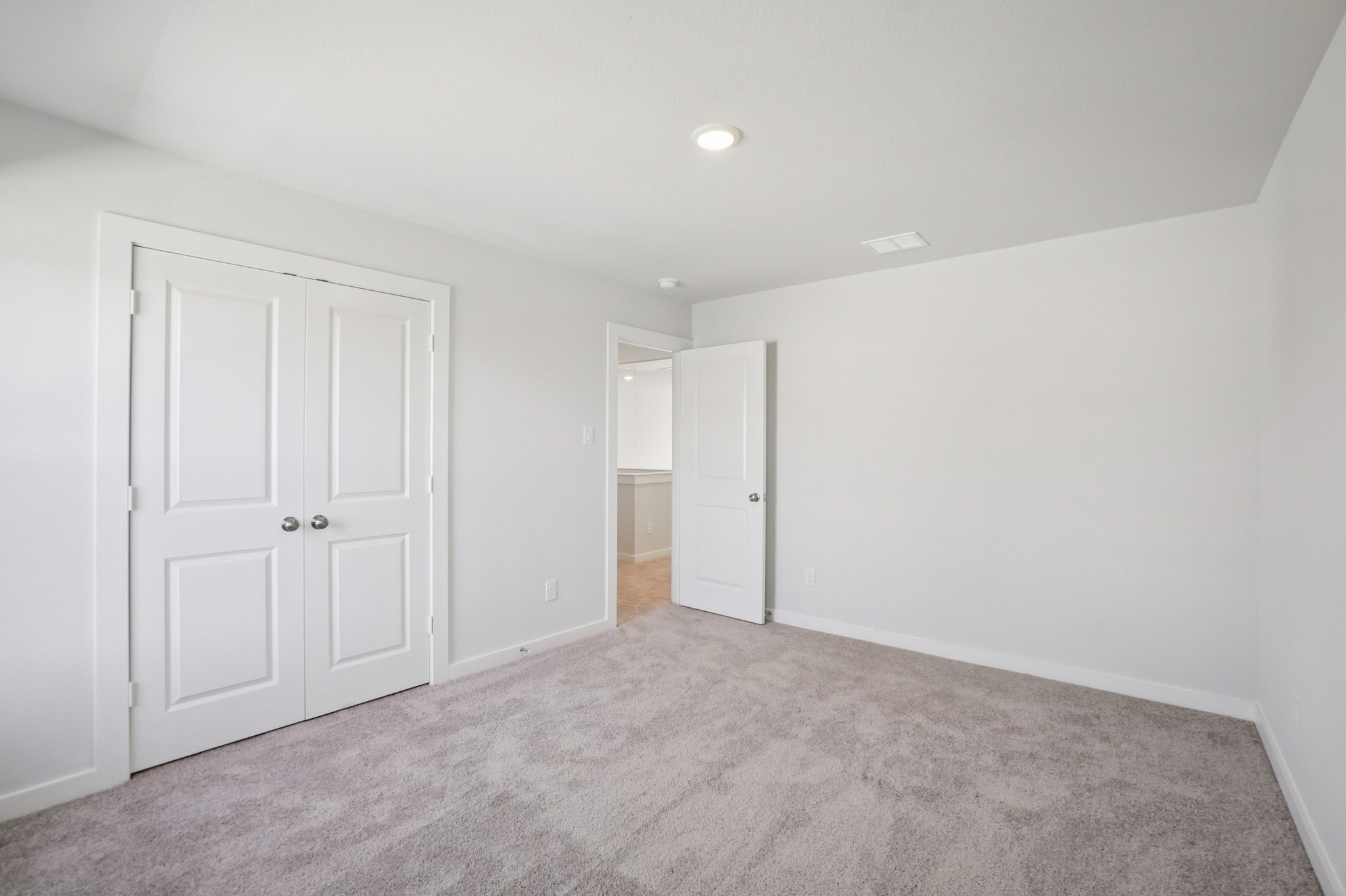 A room with white doors.