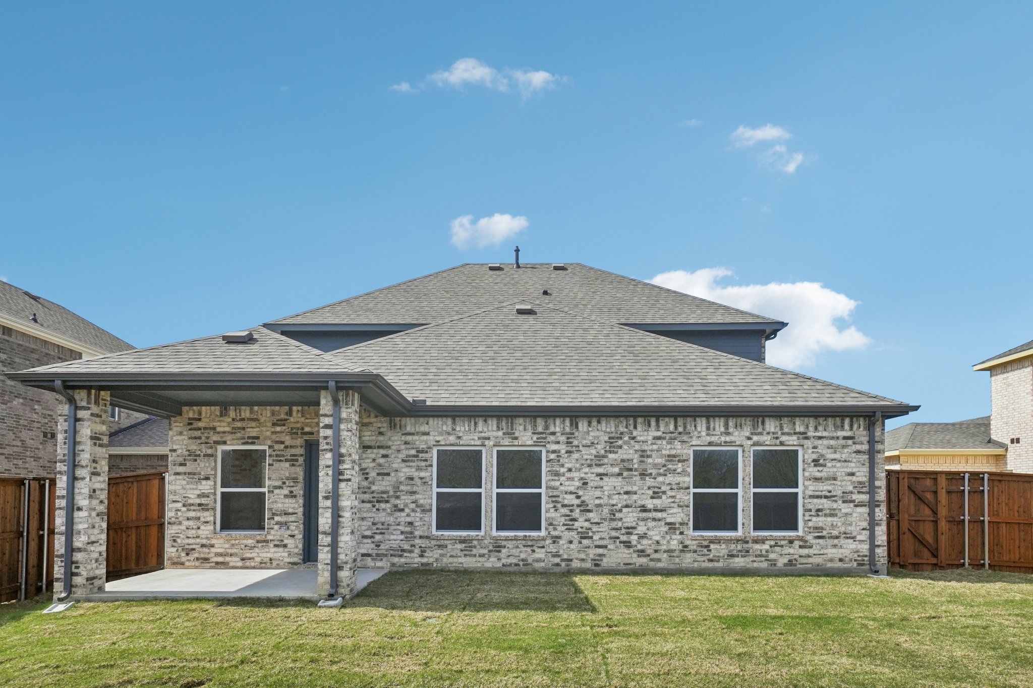 A house with a grass yard.