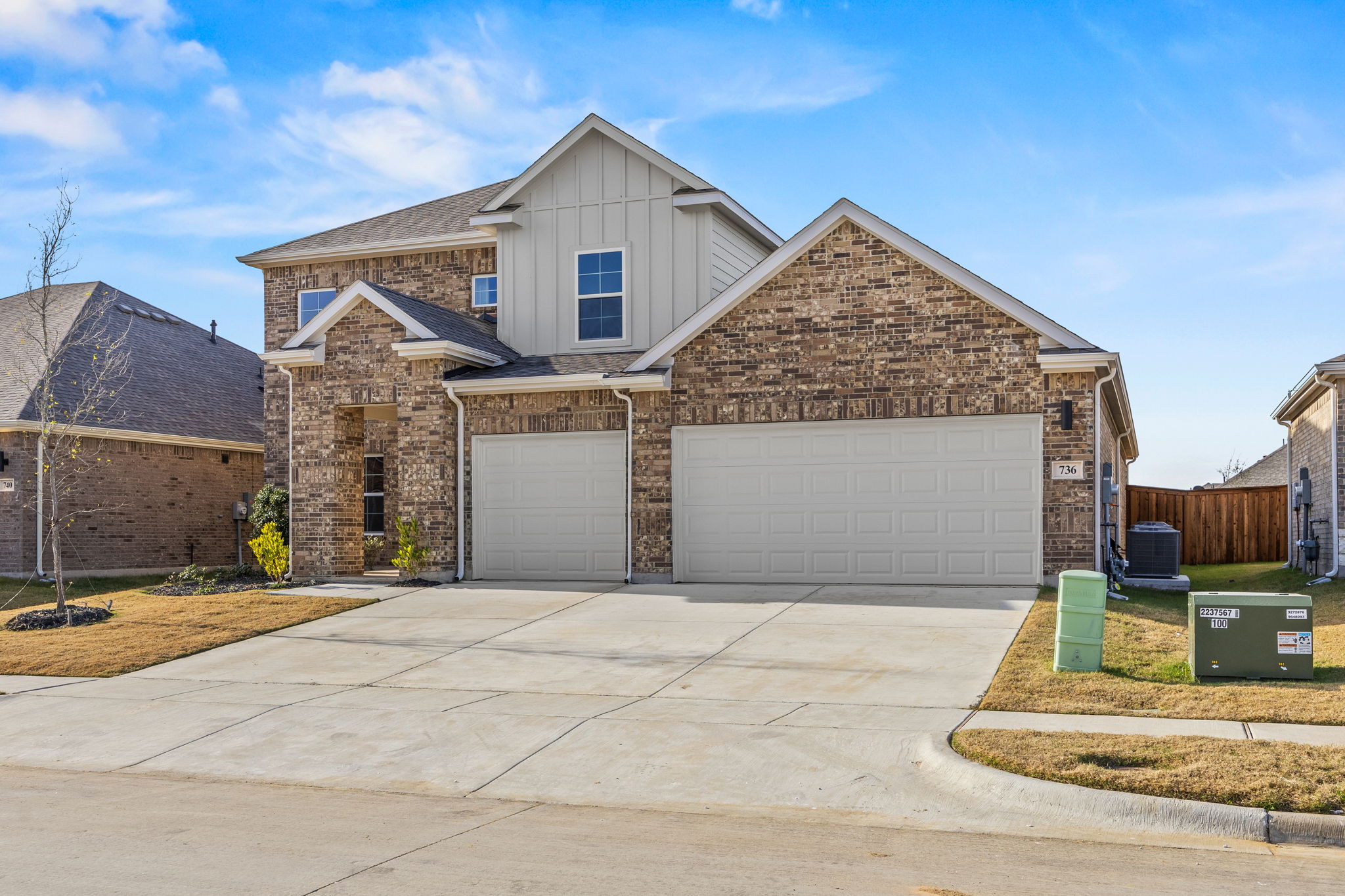 A house with garages and a driveway.