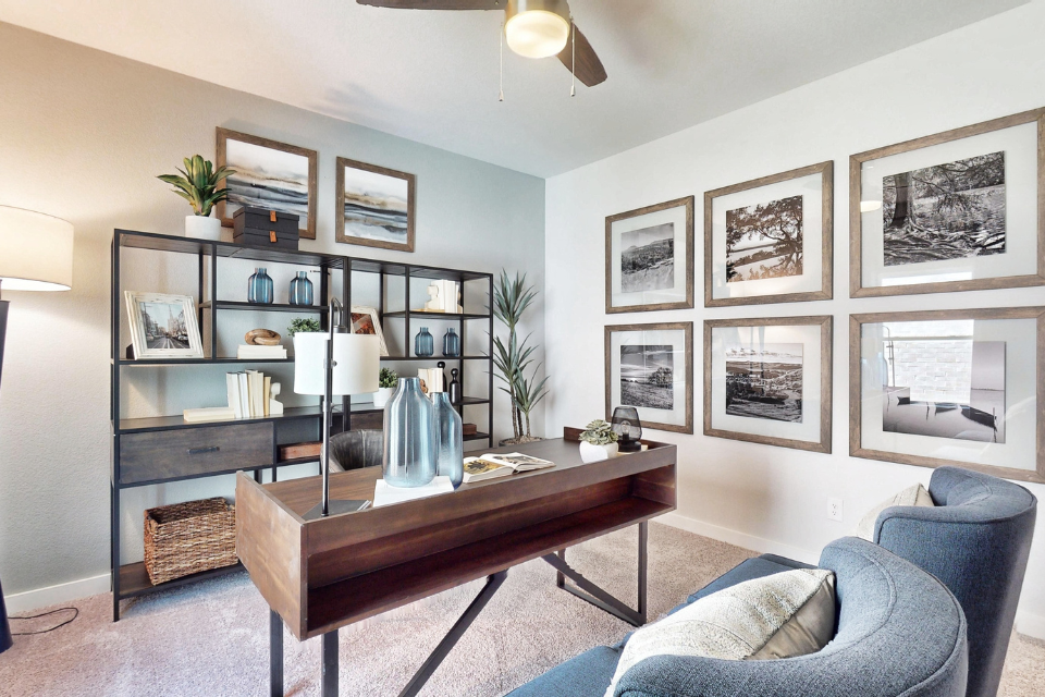 A room with a table and shelves.
