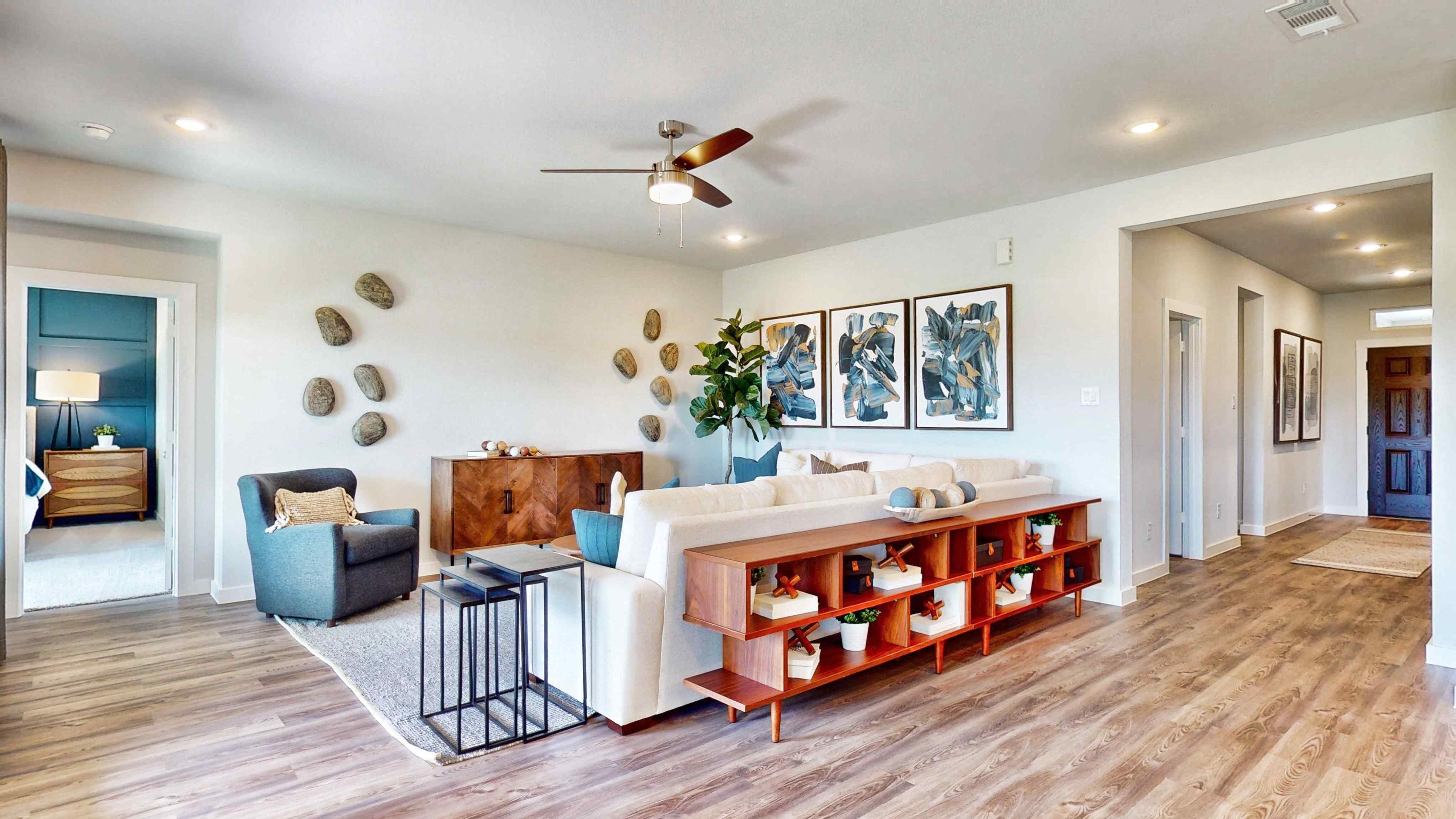A living room with a wood floor.