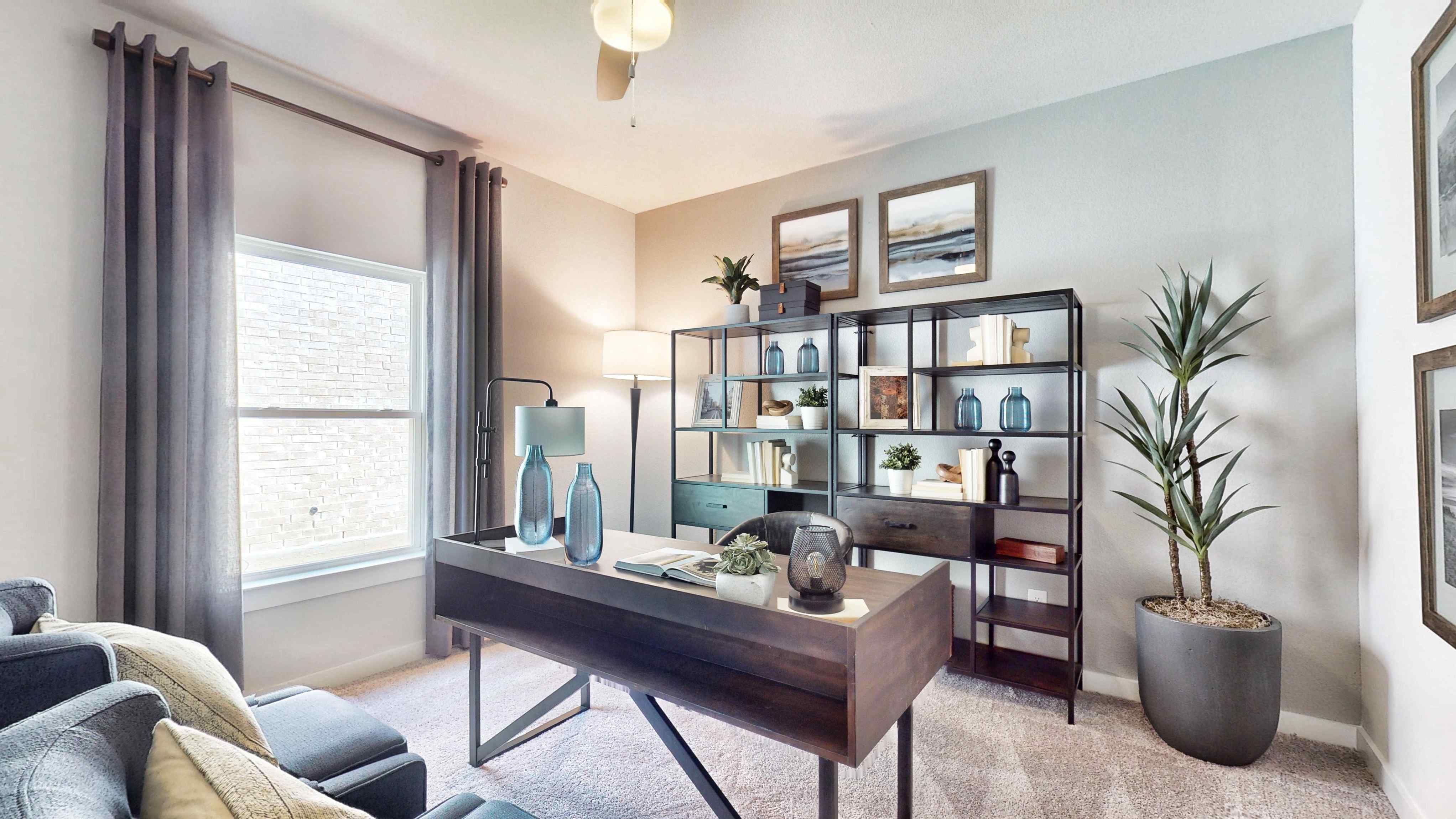 A room with a table and shelves.