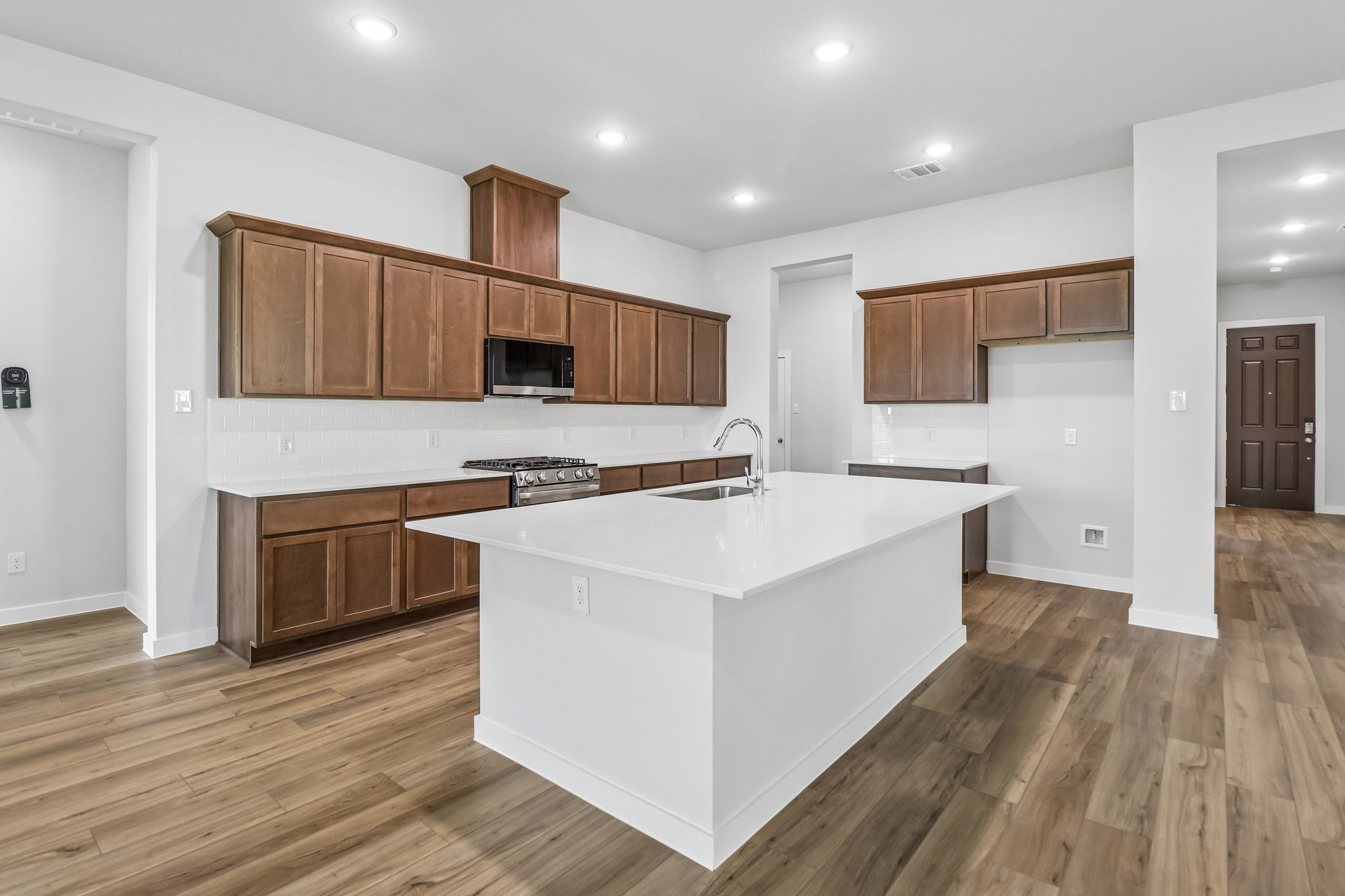 A kitchen with wooden cabinets.