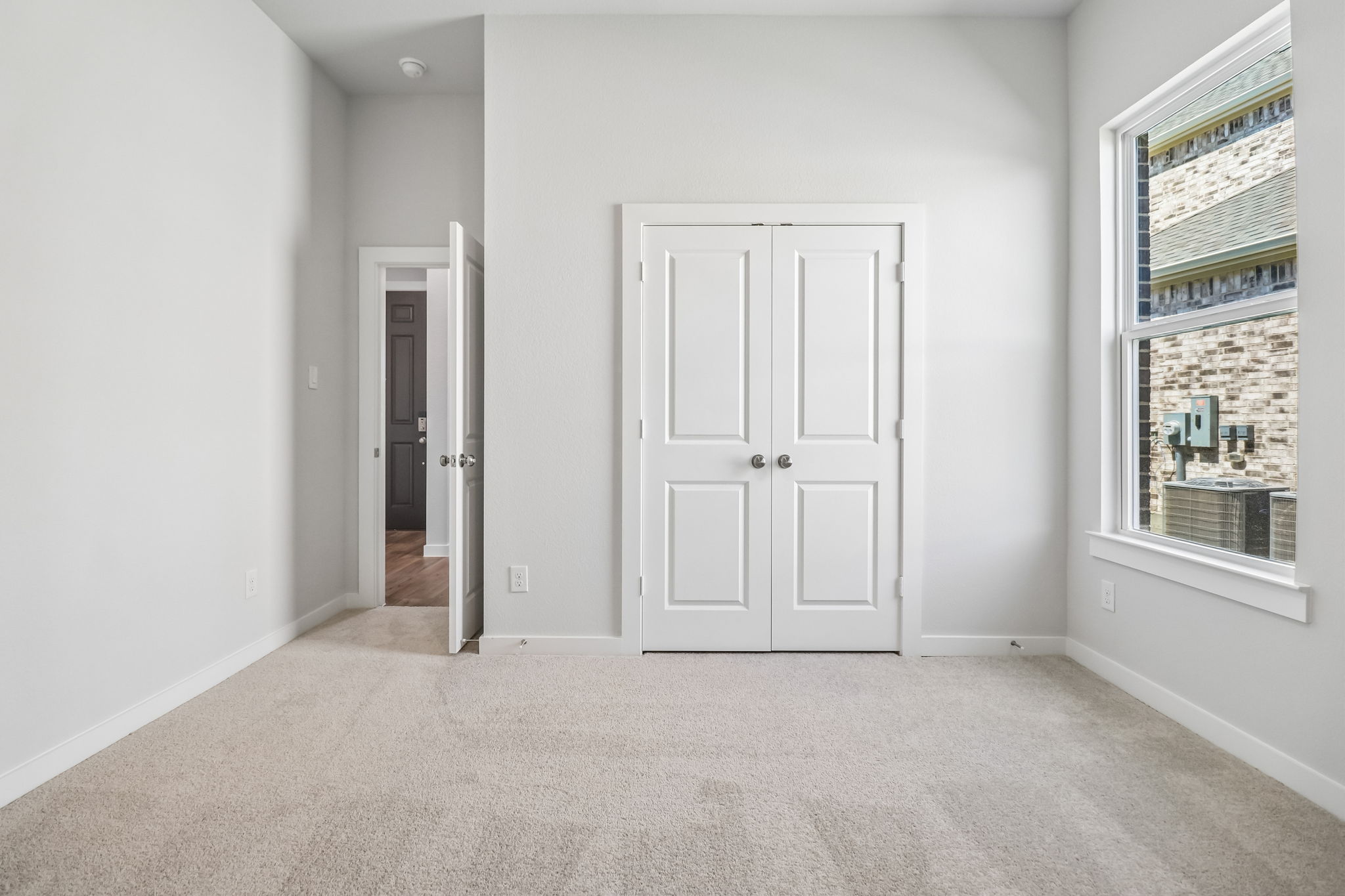 A hallway with white doors.