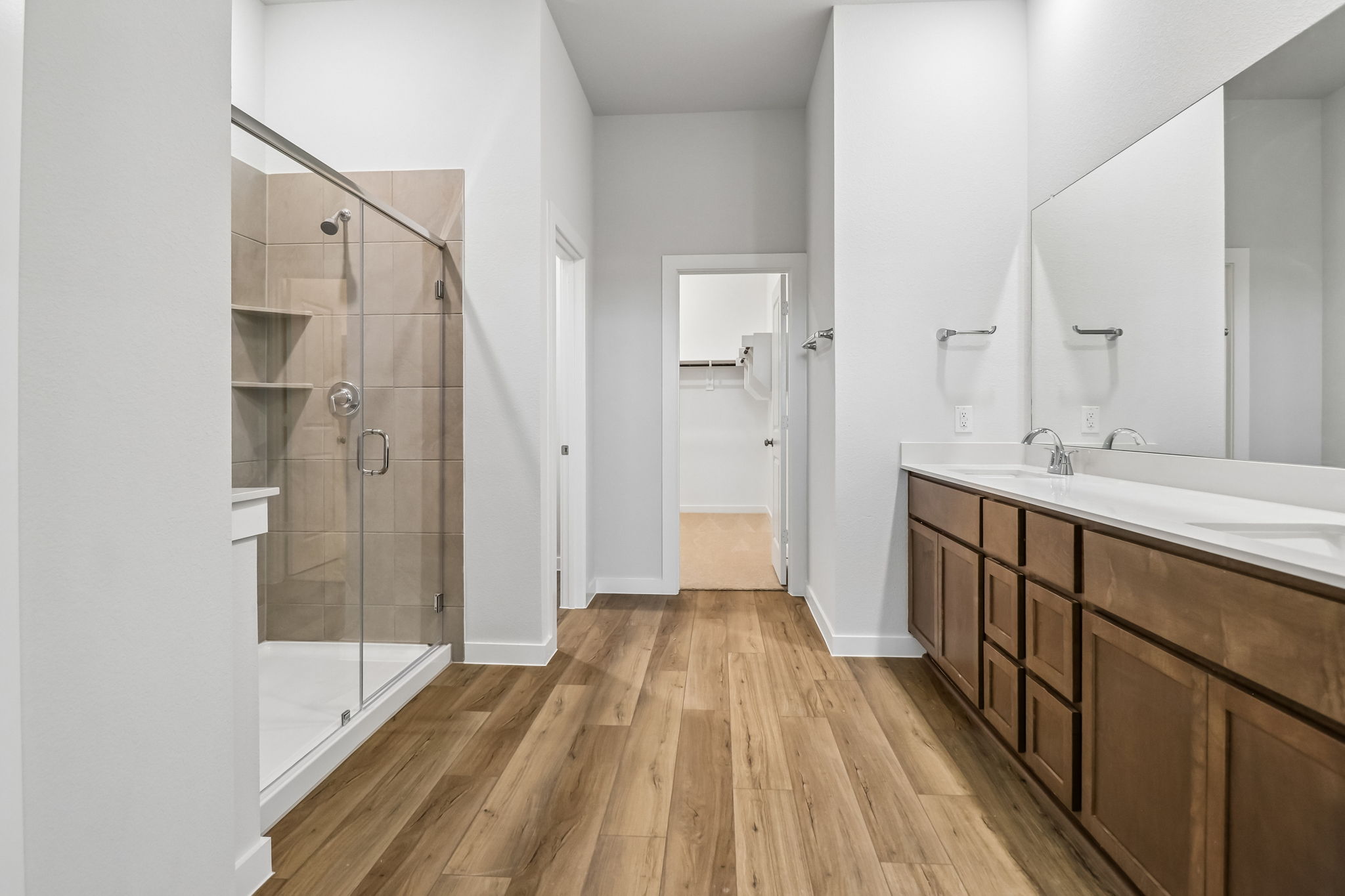 A bathroom with a glass shower.
