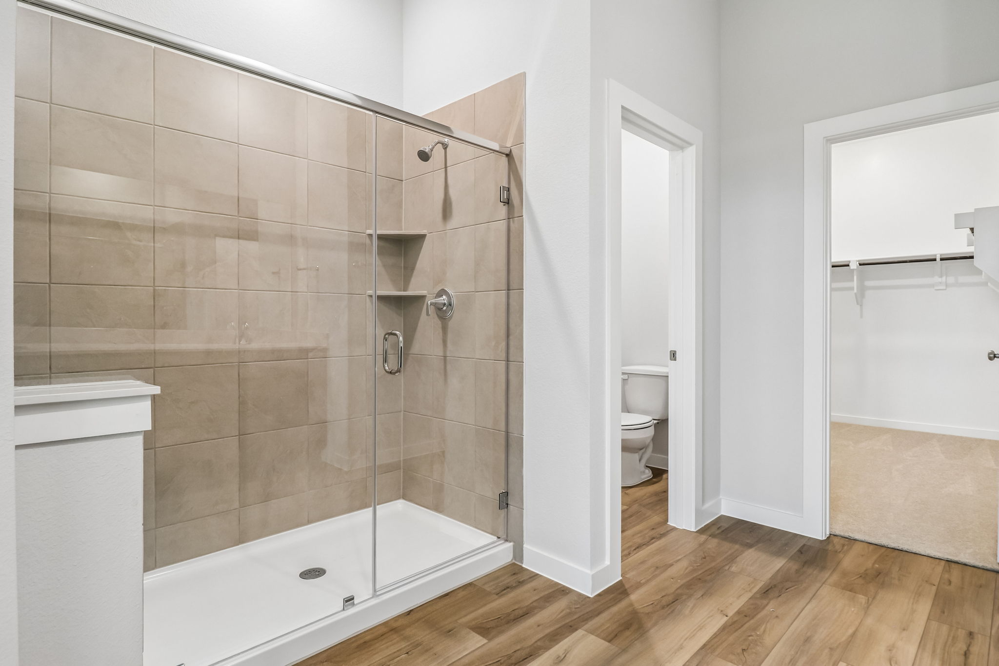 A bathroom with a glass shower.