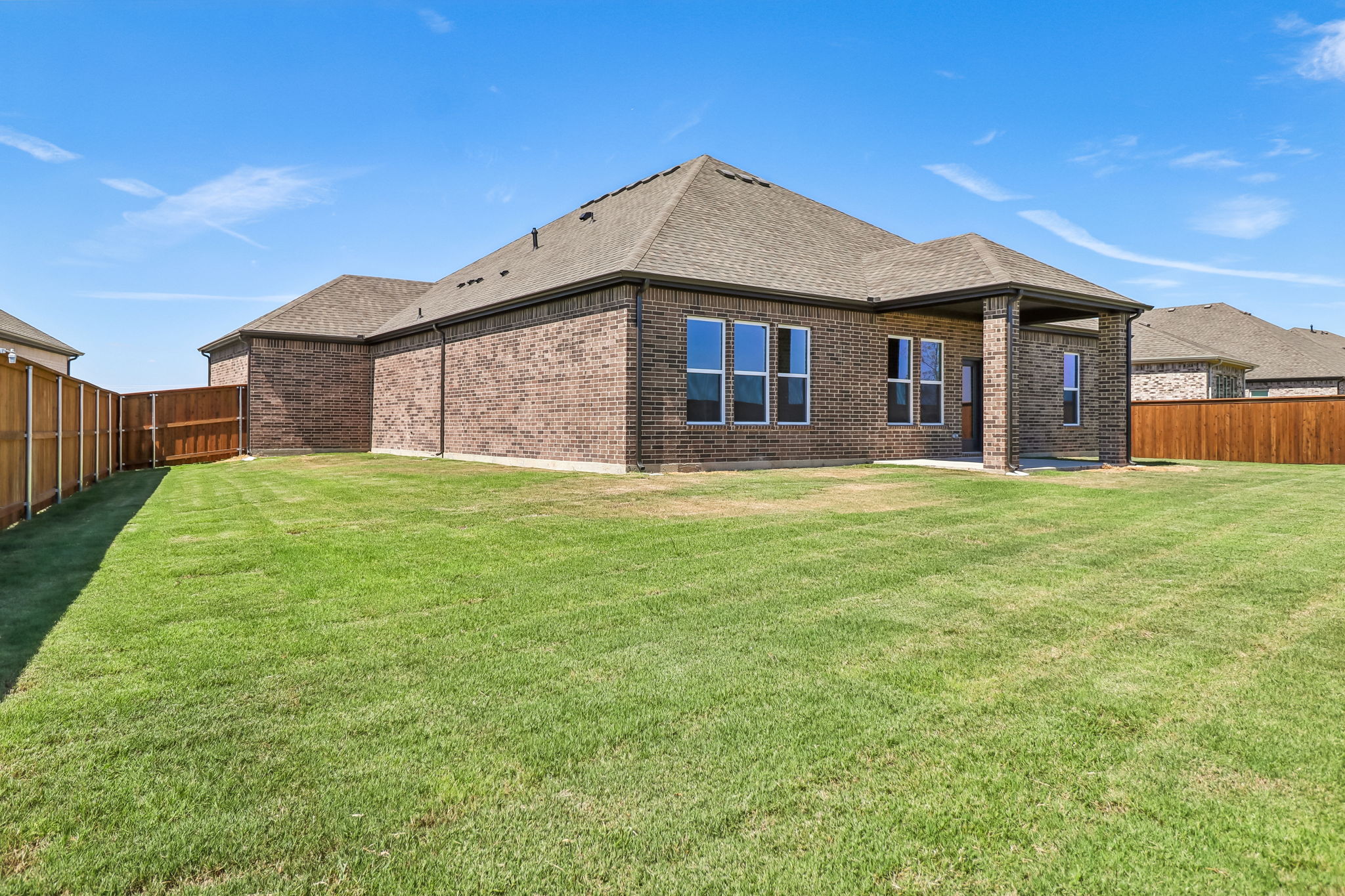 A house with a grass yard.