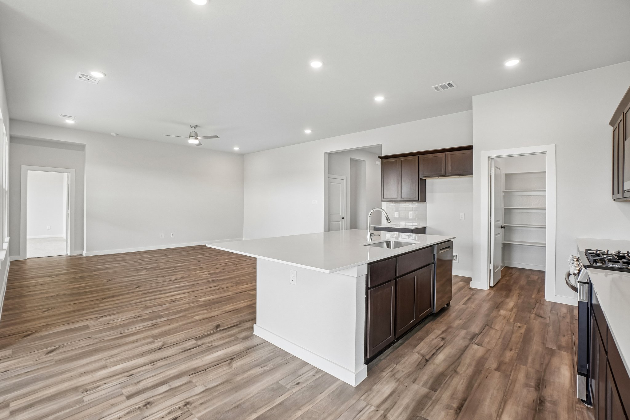A kitchen with a wood floor.