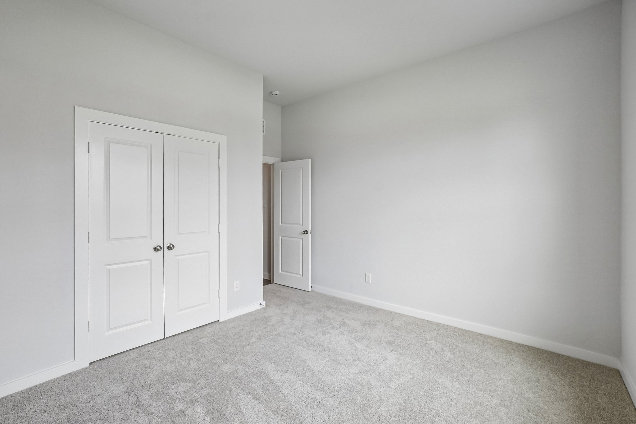A room with white doors.
