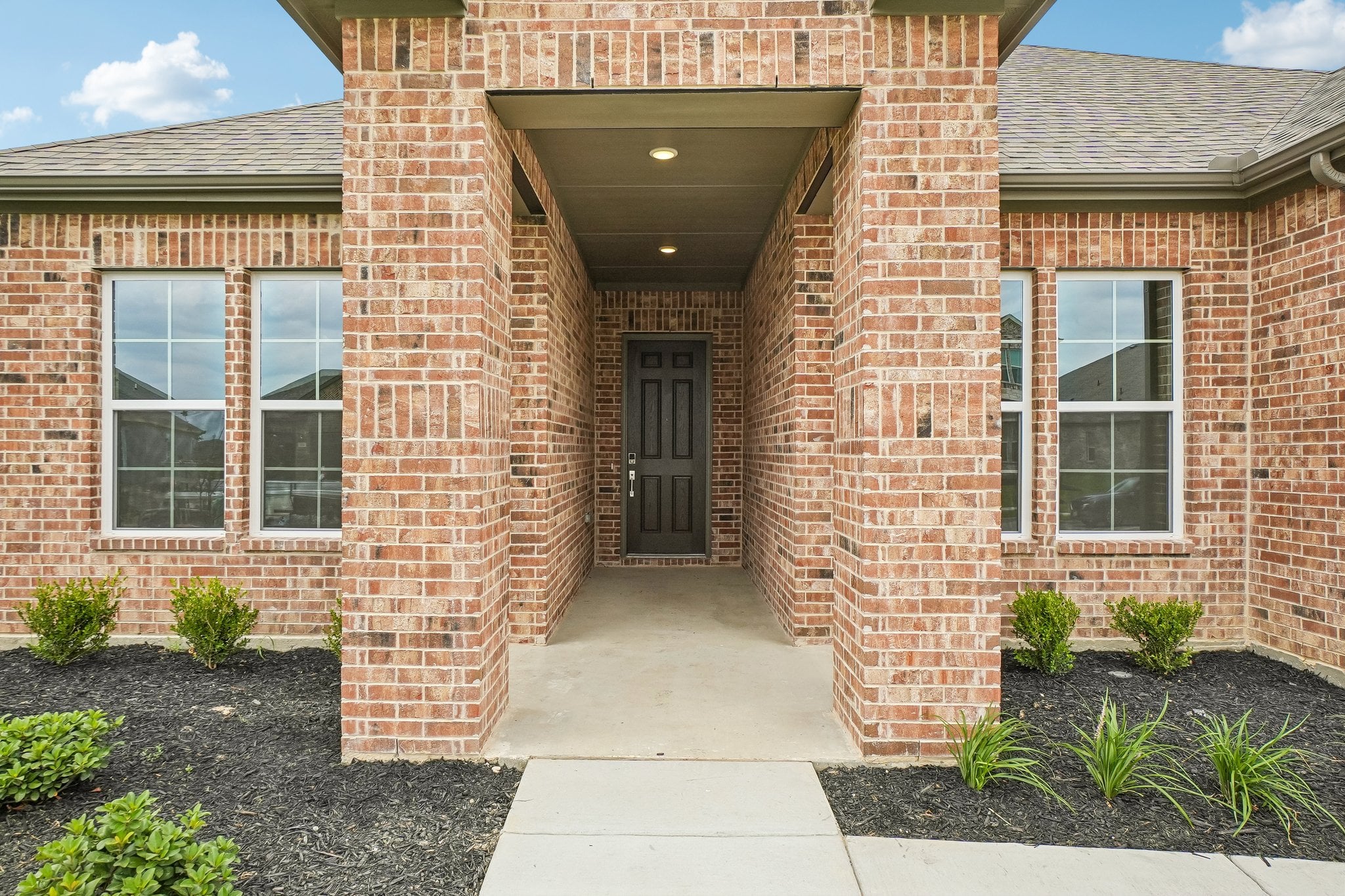 A brick building with a door.