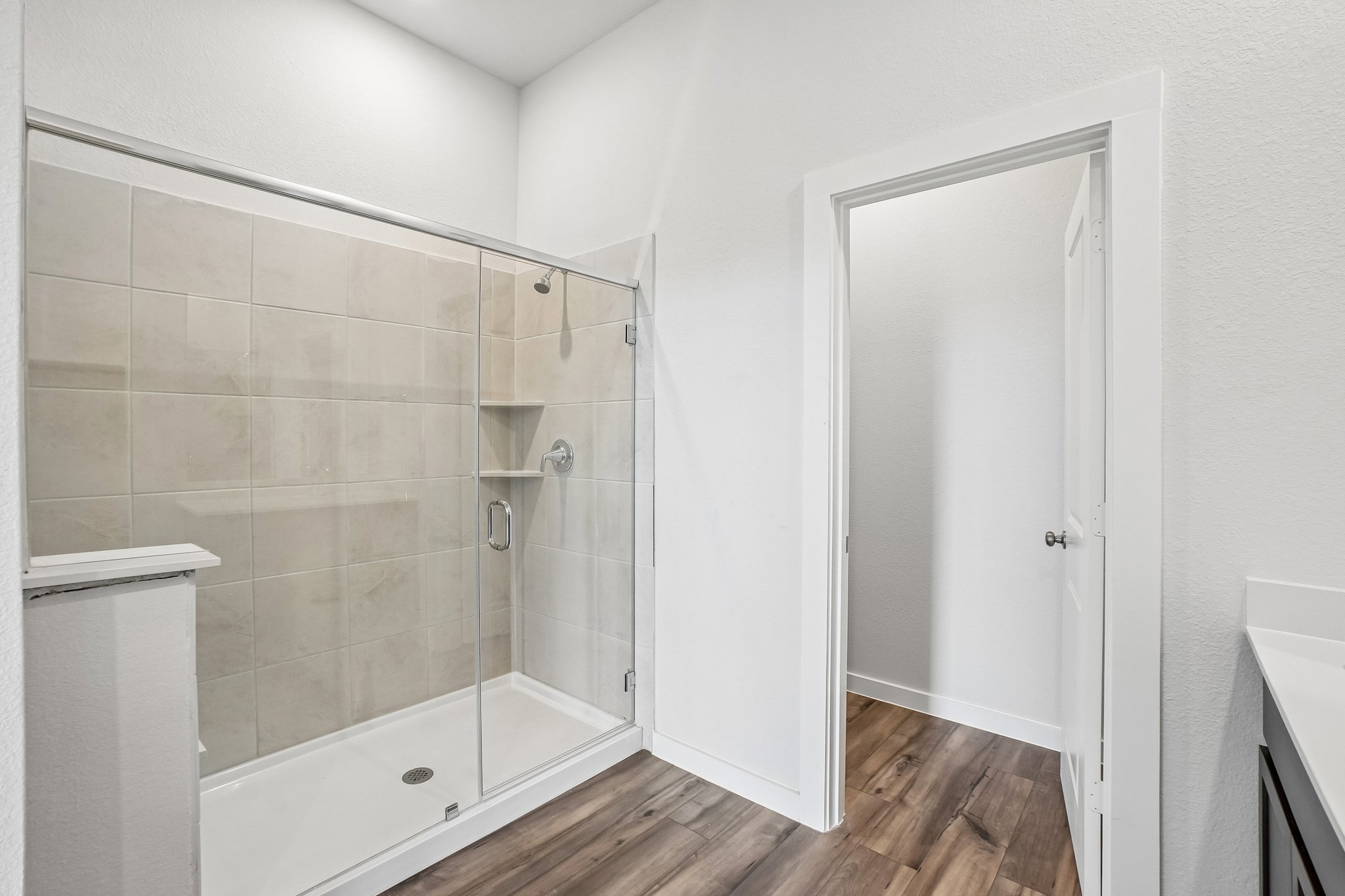 A bathroom with a glass shower.