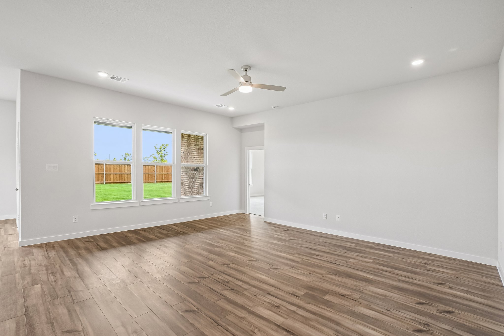A room with a wood floor and a wood floor with a wood floor.
