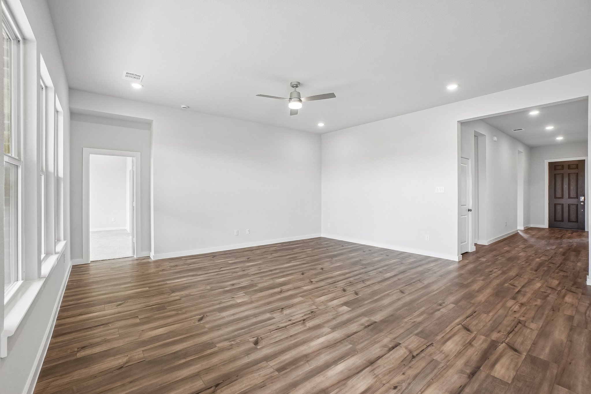 A room with a wood floor and a wood floor.