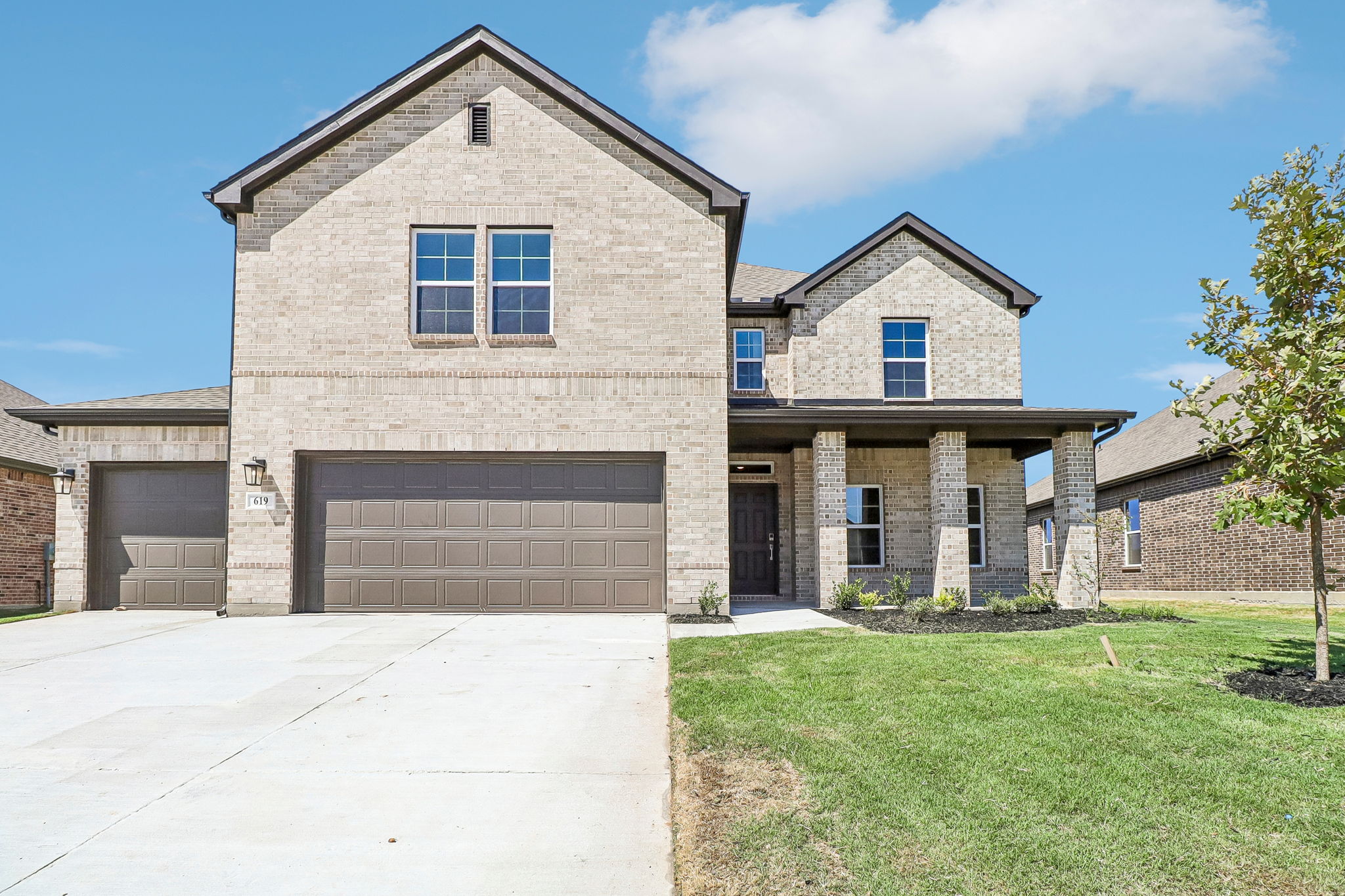 A large house with a garage.
