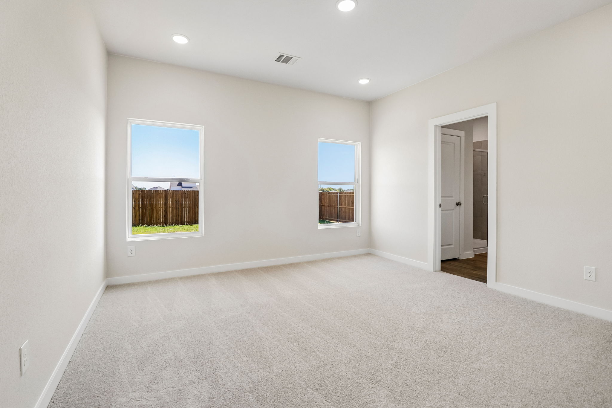 A room with a window and a door.