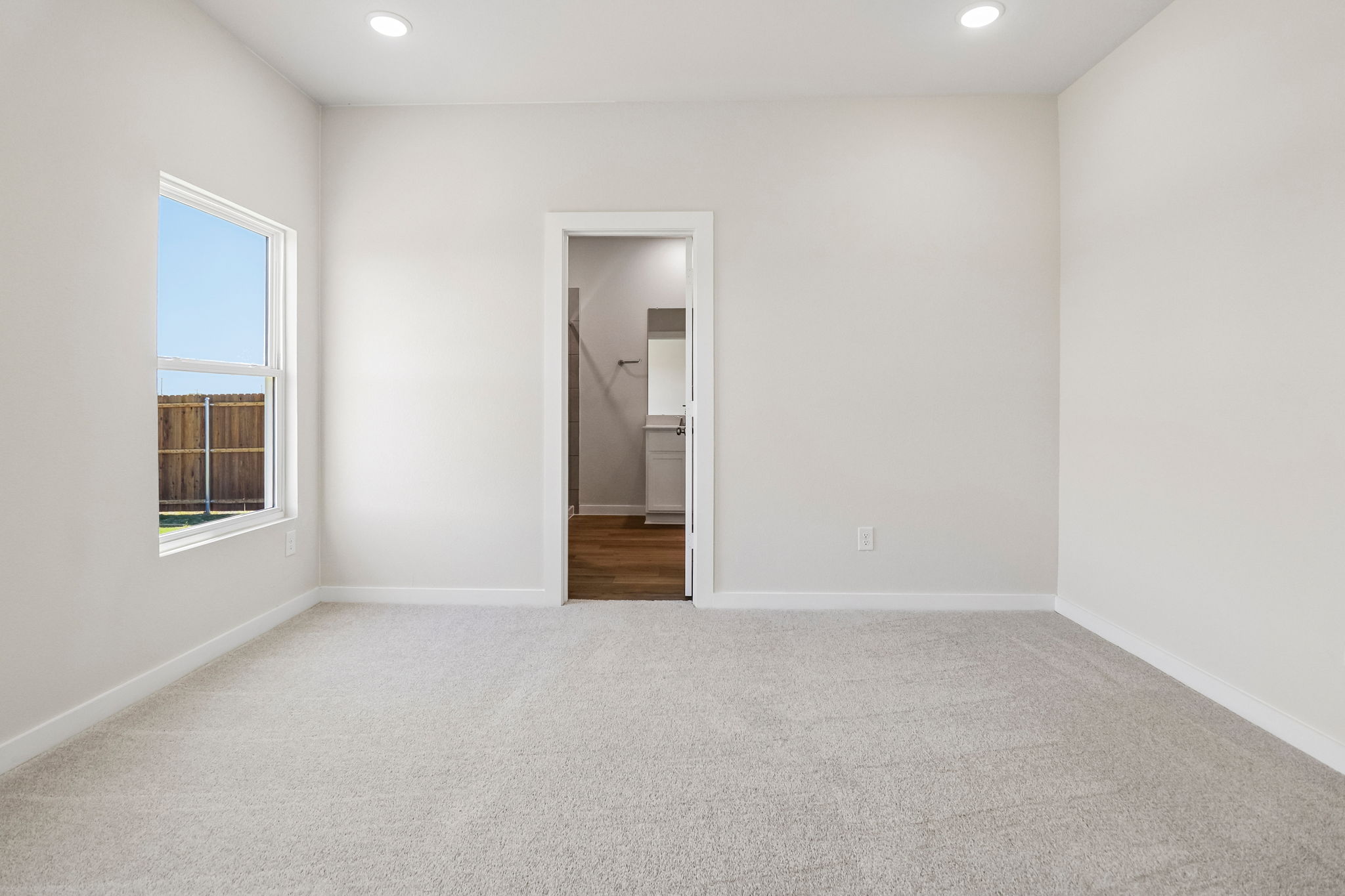 A room with a door and a window.