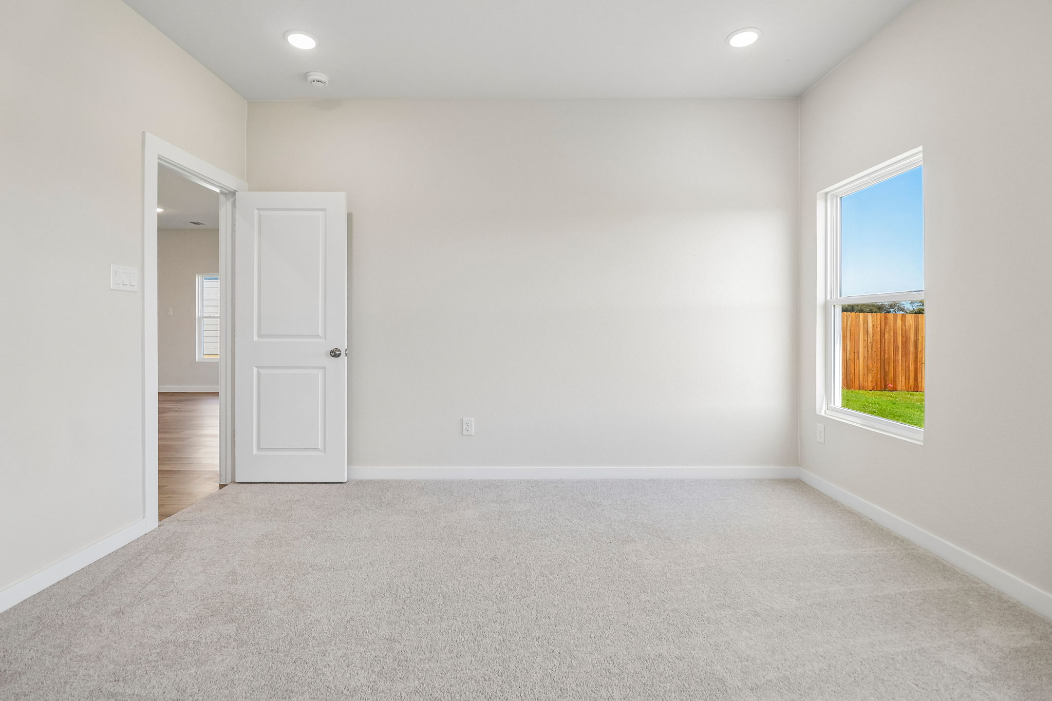 A room with a door and a window.