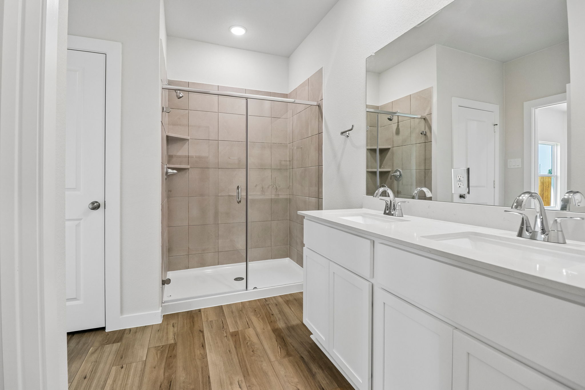 A bathroom with a glass shower.