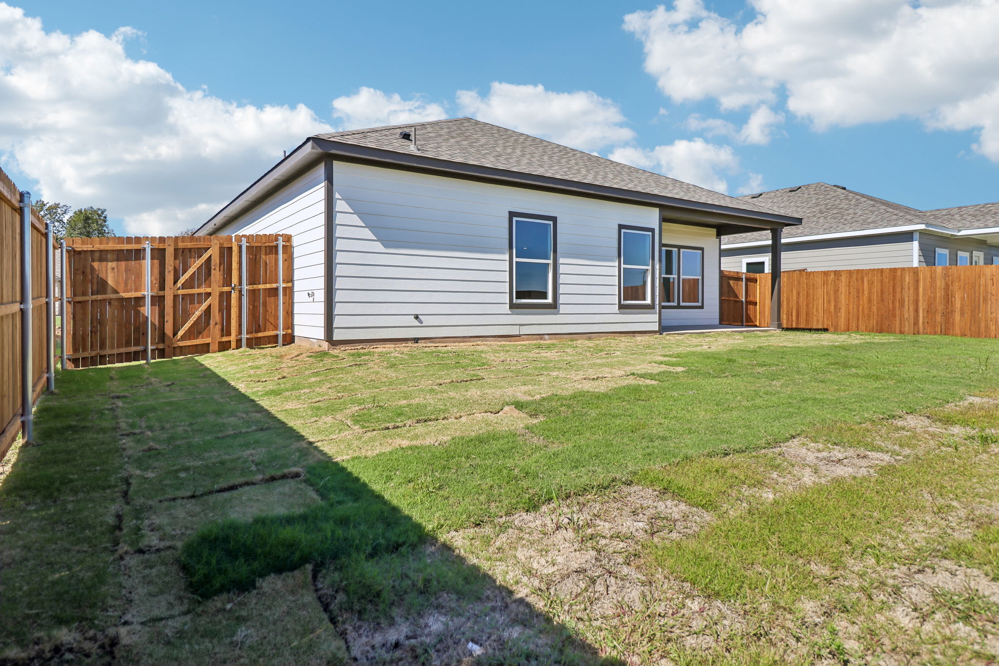 A house with a fence around it.